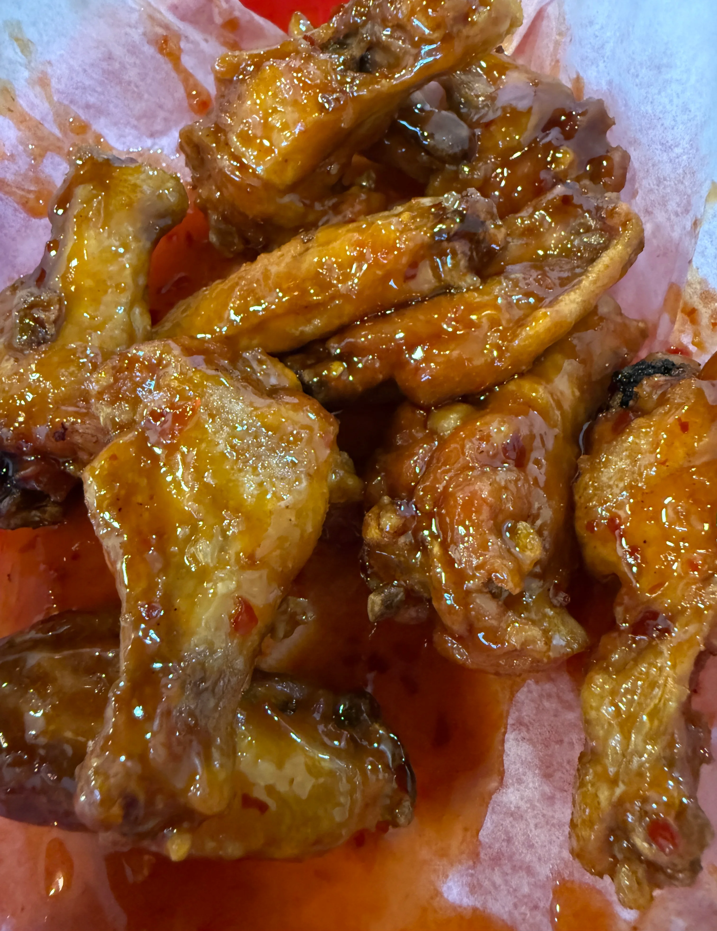 Sticky Asian-style chicken wings glazed in sauce