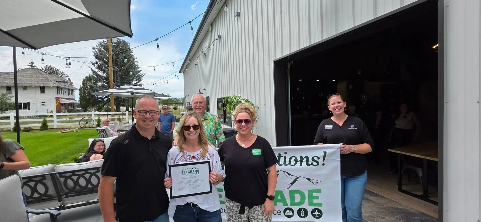 Celebration event at a restaurant with a certificate presentation