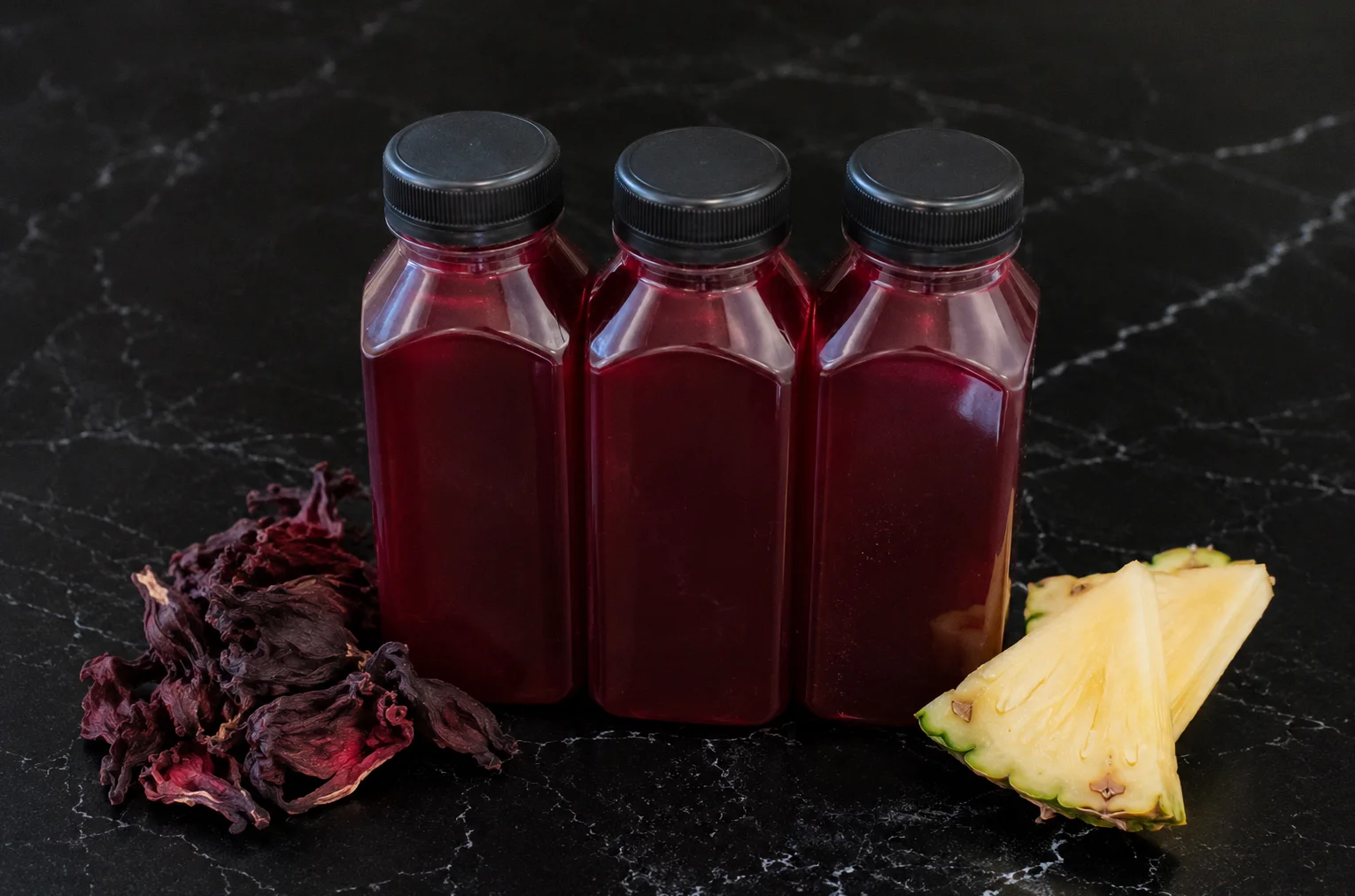 Hibiscus tea bottles with pineapple slices