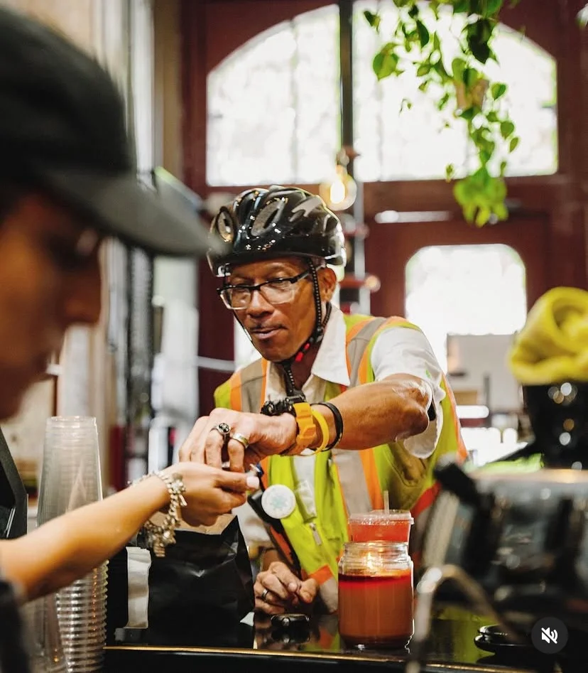 Customer making a purchase at a vibrant café counter