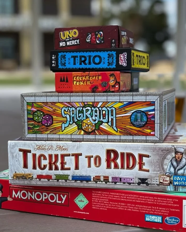 Colorful game pieces and dice on a board game