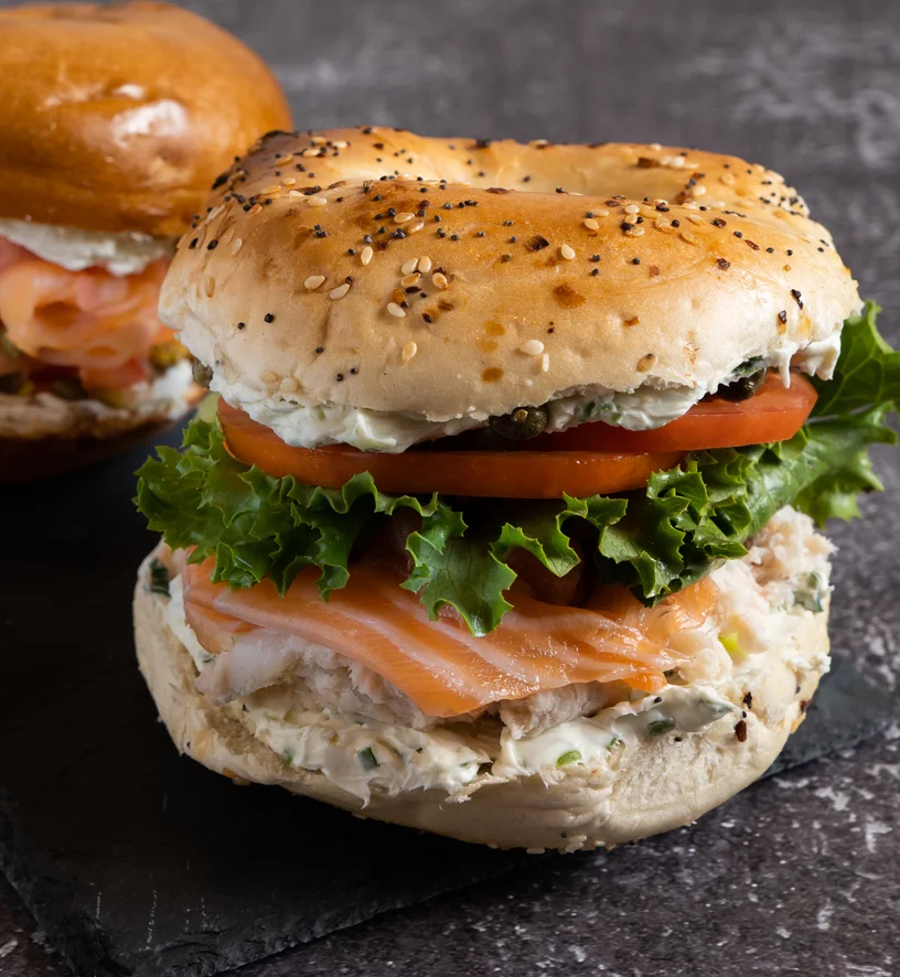 Nova and whitefish salad sandwich on a poppy seed bagel