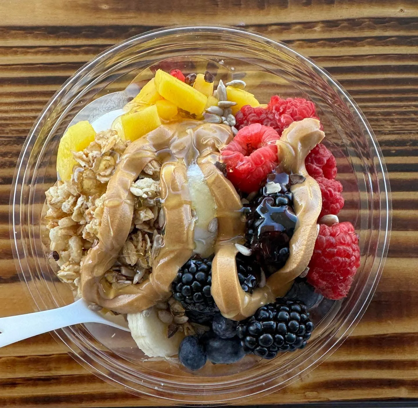 Colorful acai bowl topped with fresh fruits and granola