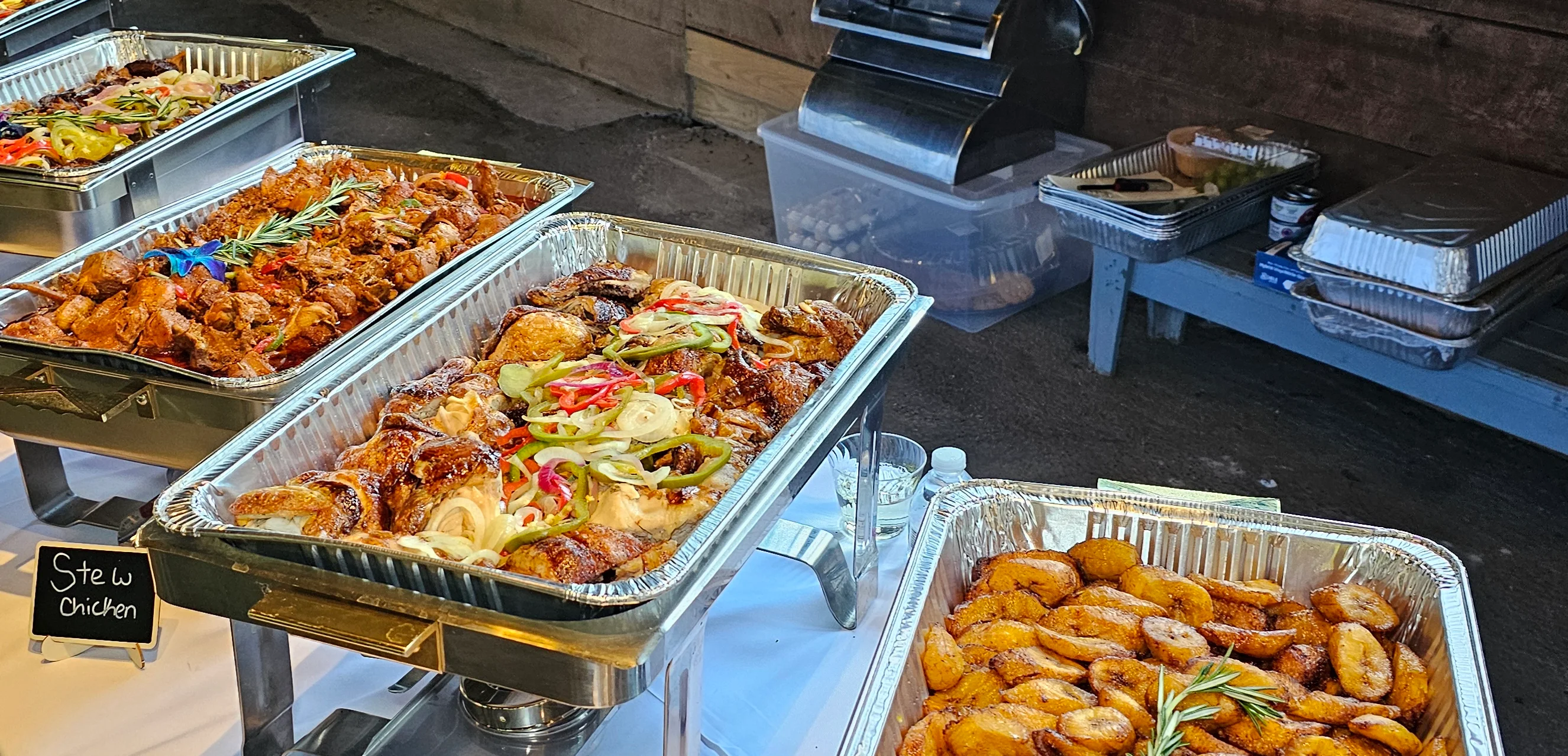 Caribbean-style roasted chicken and fried plantains at a buffet