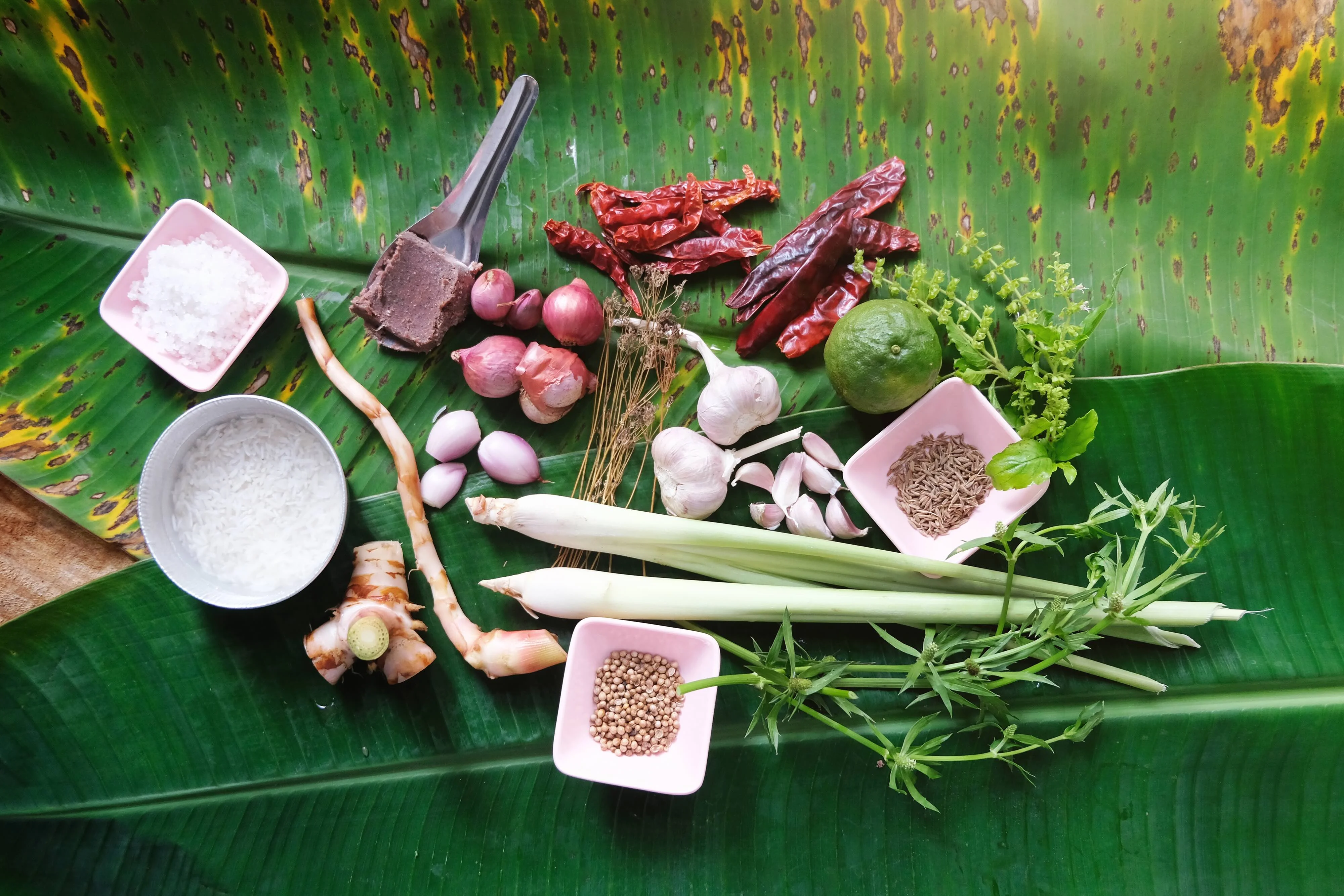 Thai curry ingredients on banana leaves