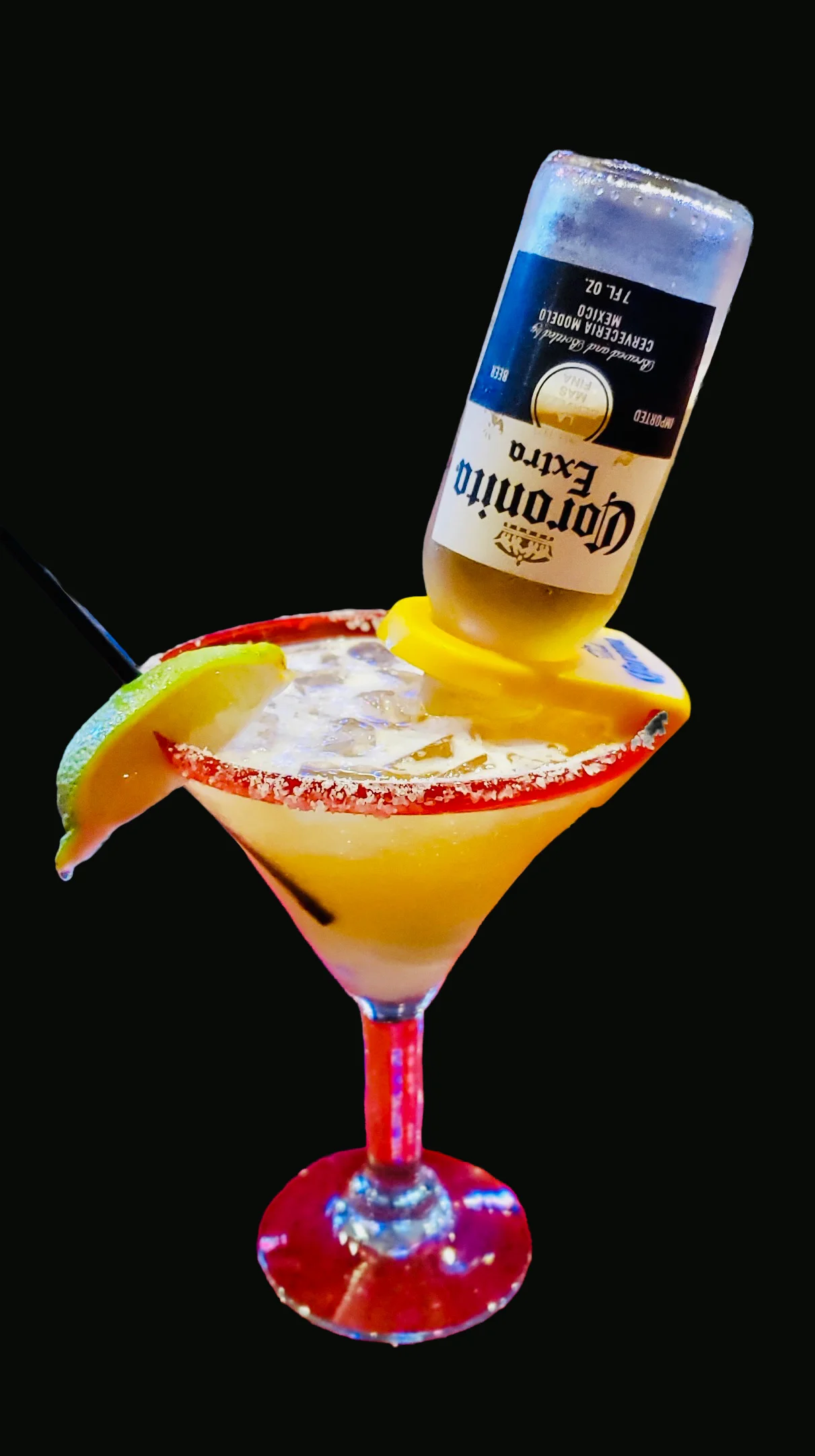 Colorful margarita cocktail with beer upside down