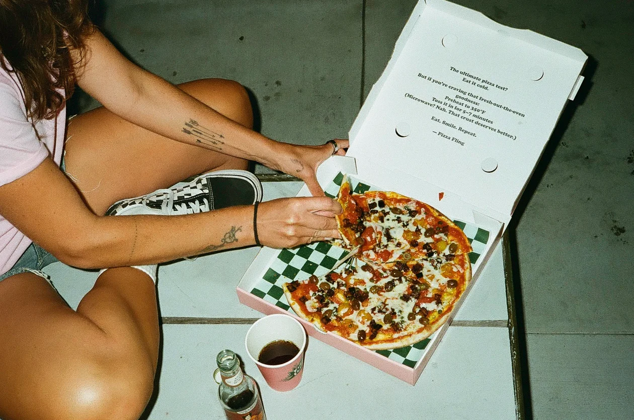 Delicious pepperoni pizza in a takeout box