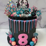 Colorful birthday cake with musical theme and vibrant decorations