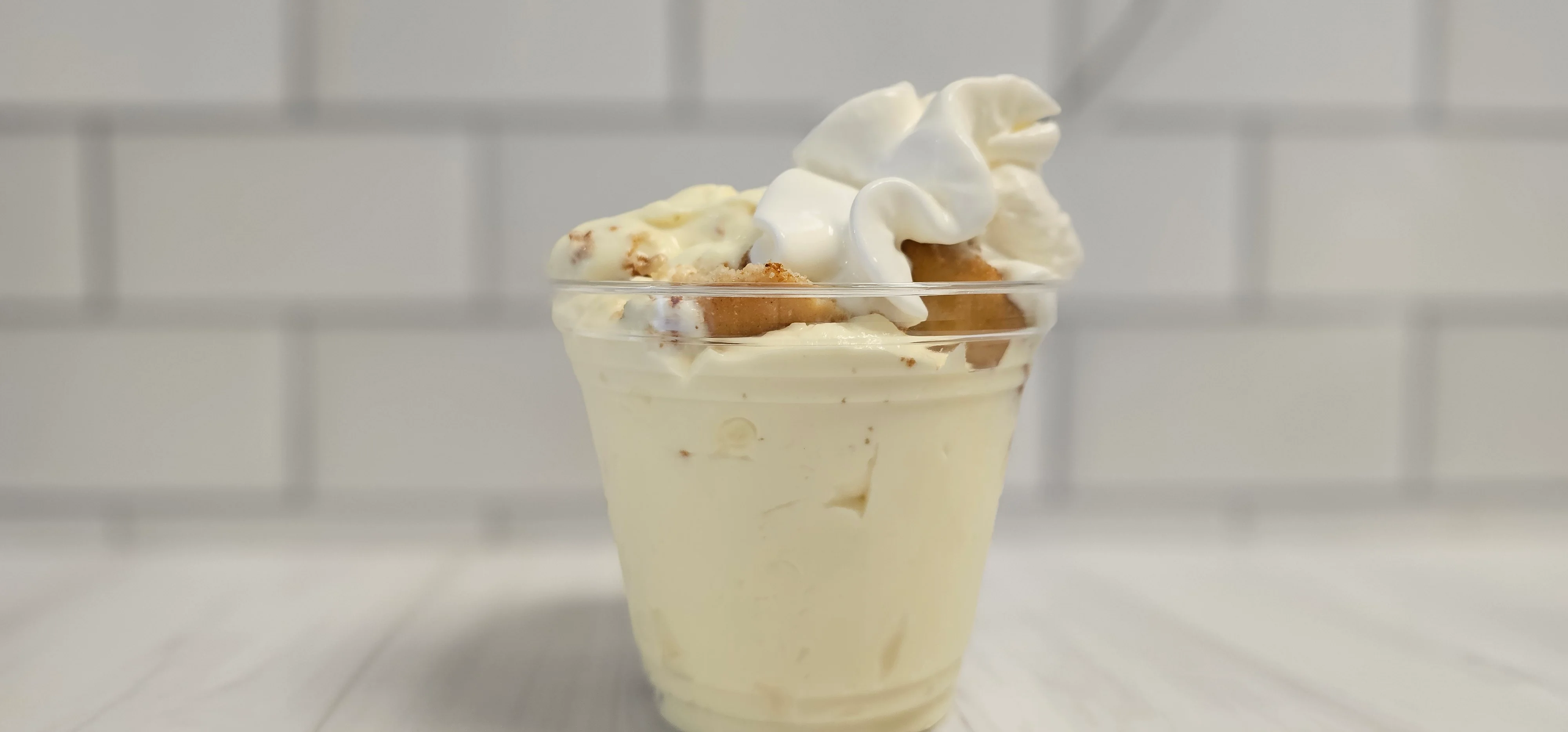 Creamy vanilla ice cream sundae with whipped cream