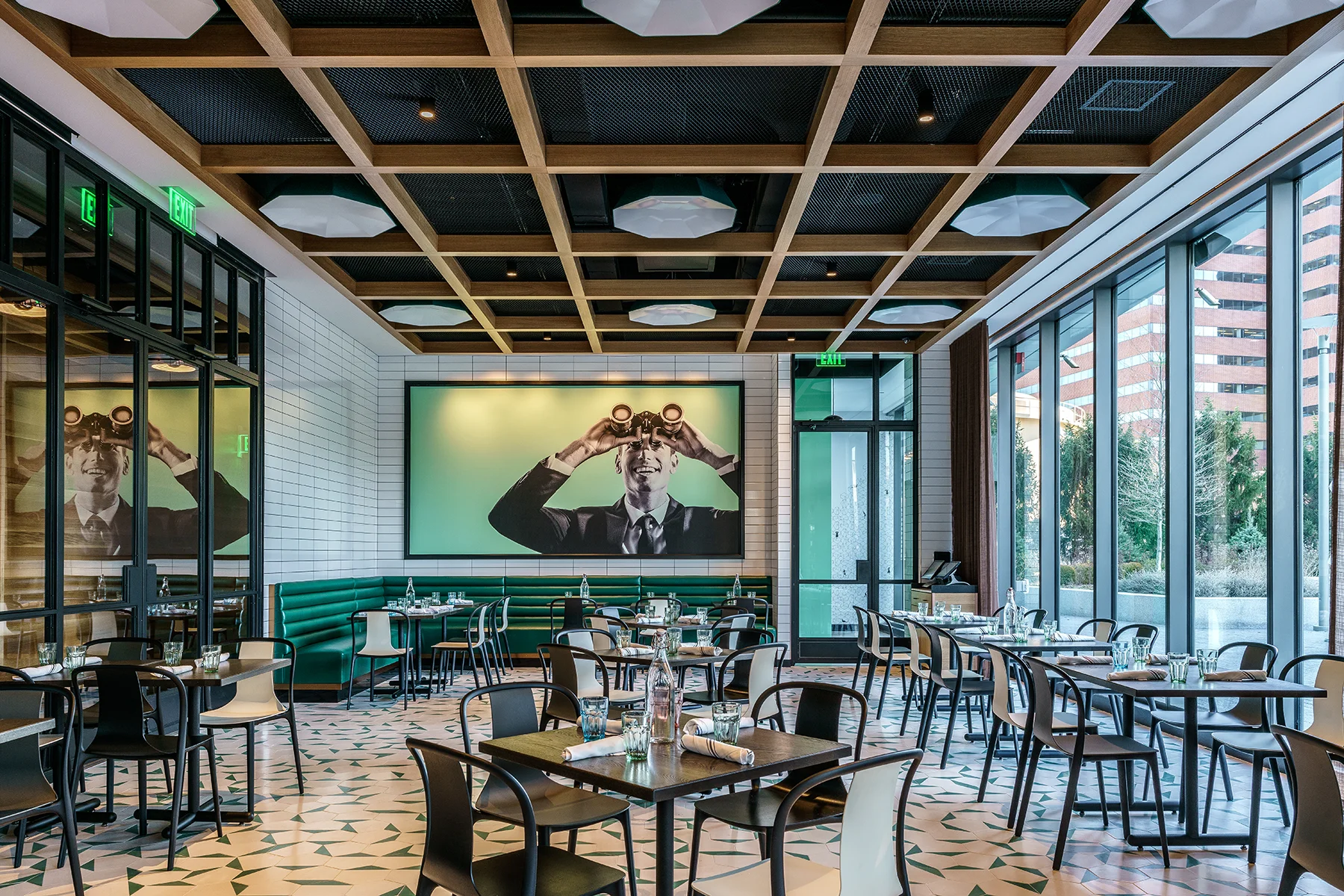 Modern restaurant interior with stylish decor and large windows