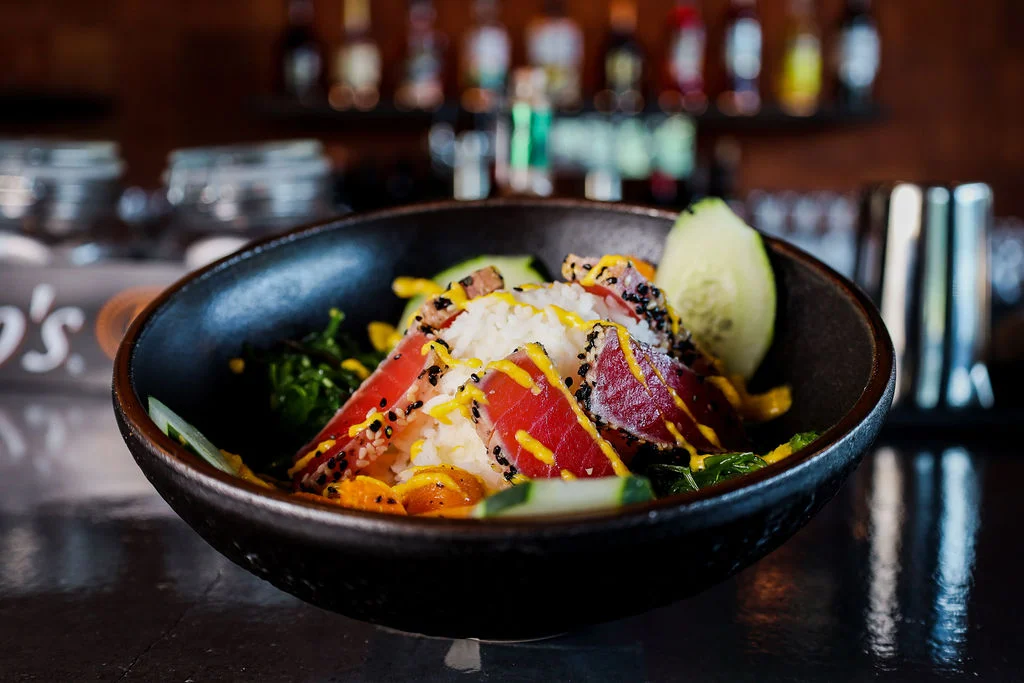 Japanese poke bowl with seared tuna and fresh vegetables