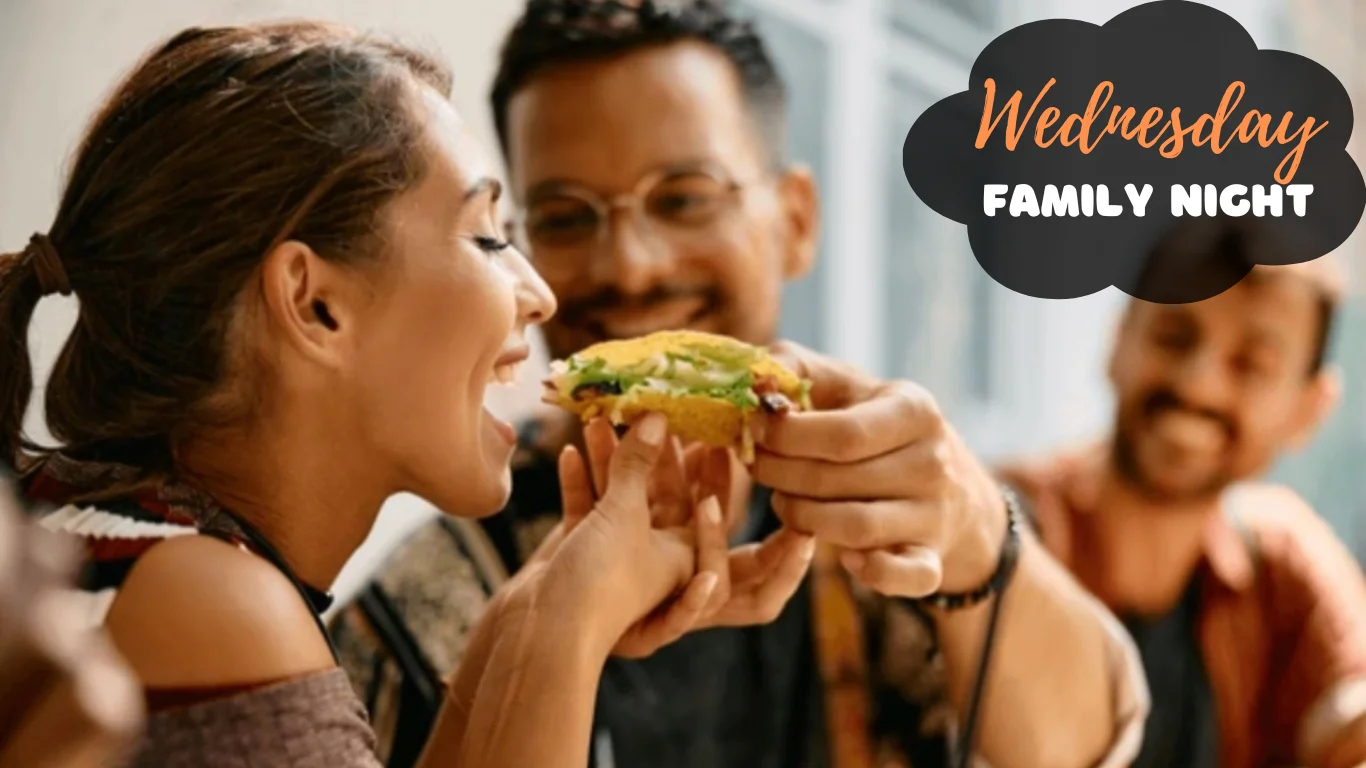 Friends enjoying tacos during family night at a restaurant