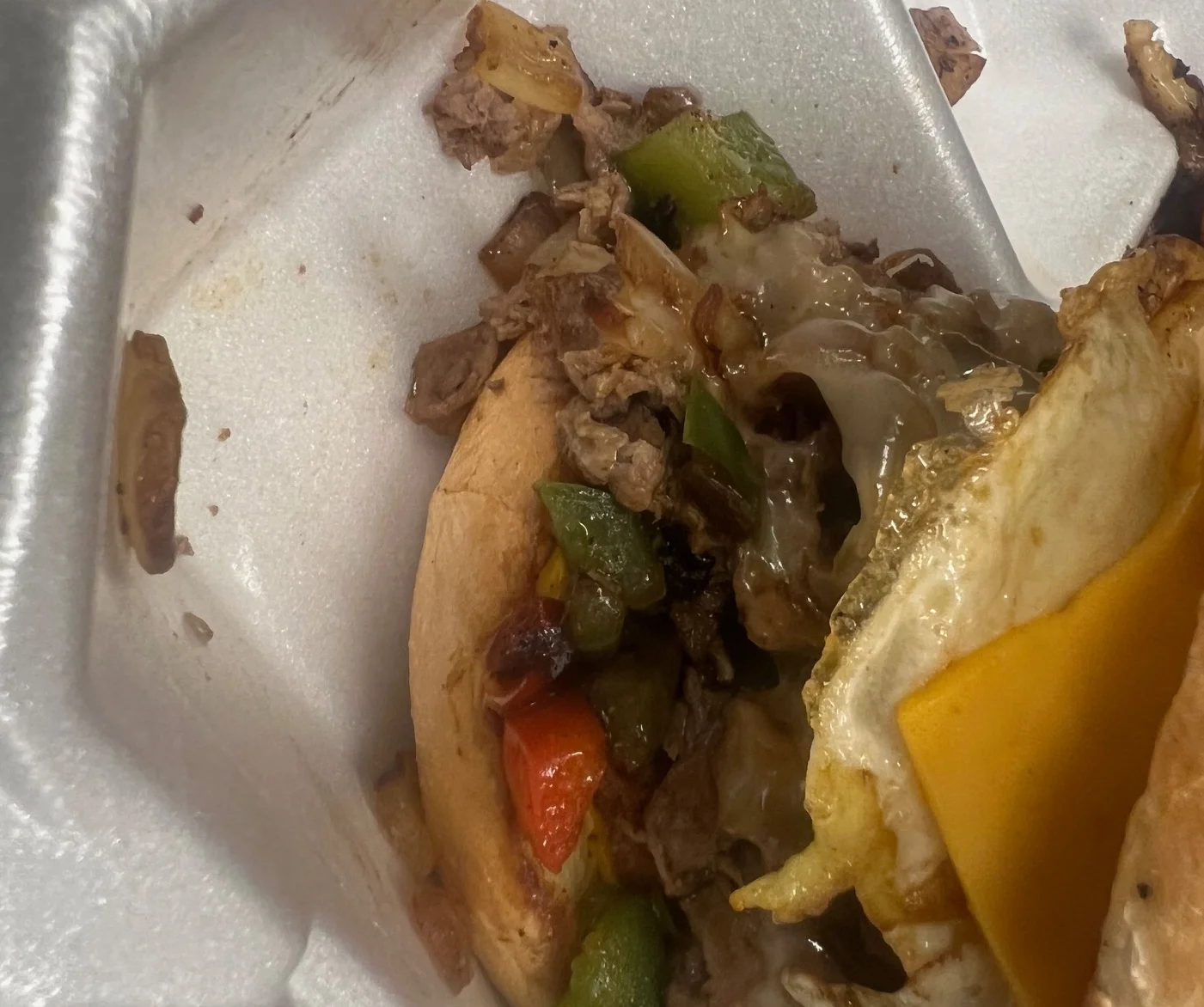 Loaded cheesesteak sandwich with egg