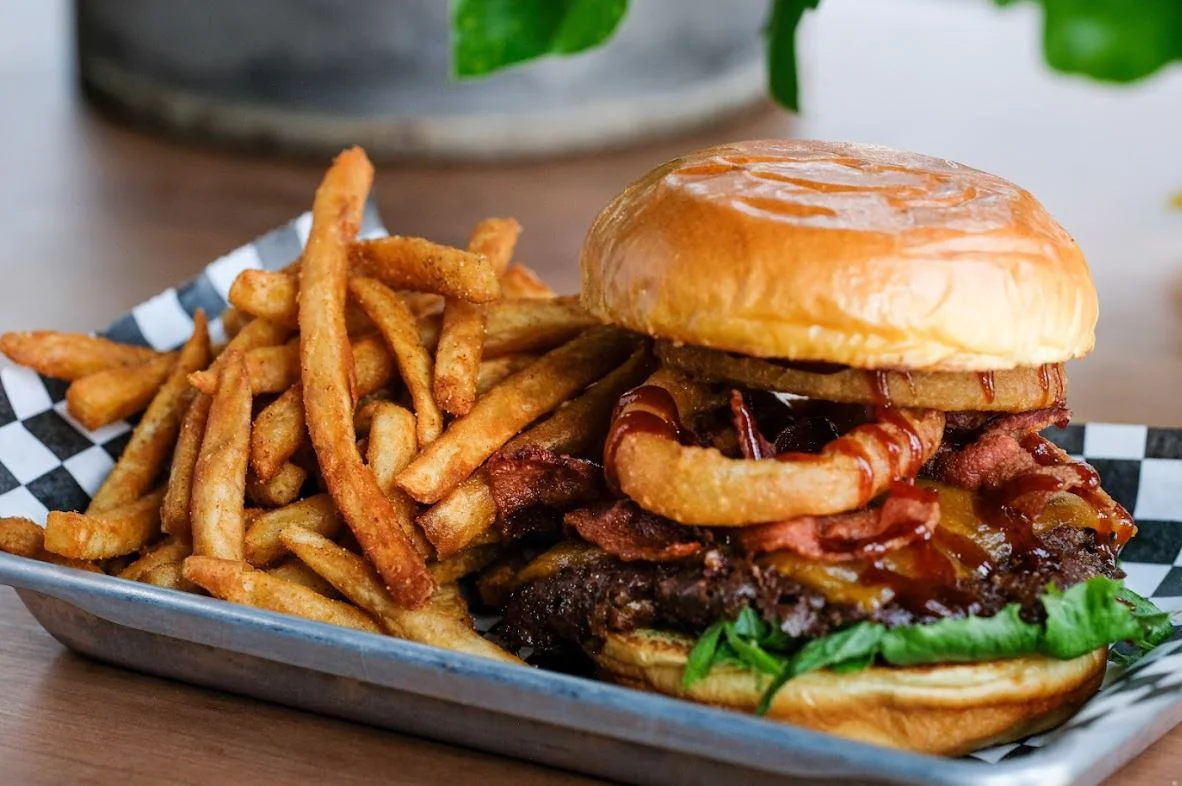 Juicy American cheeseburger with crispy fries