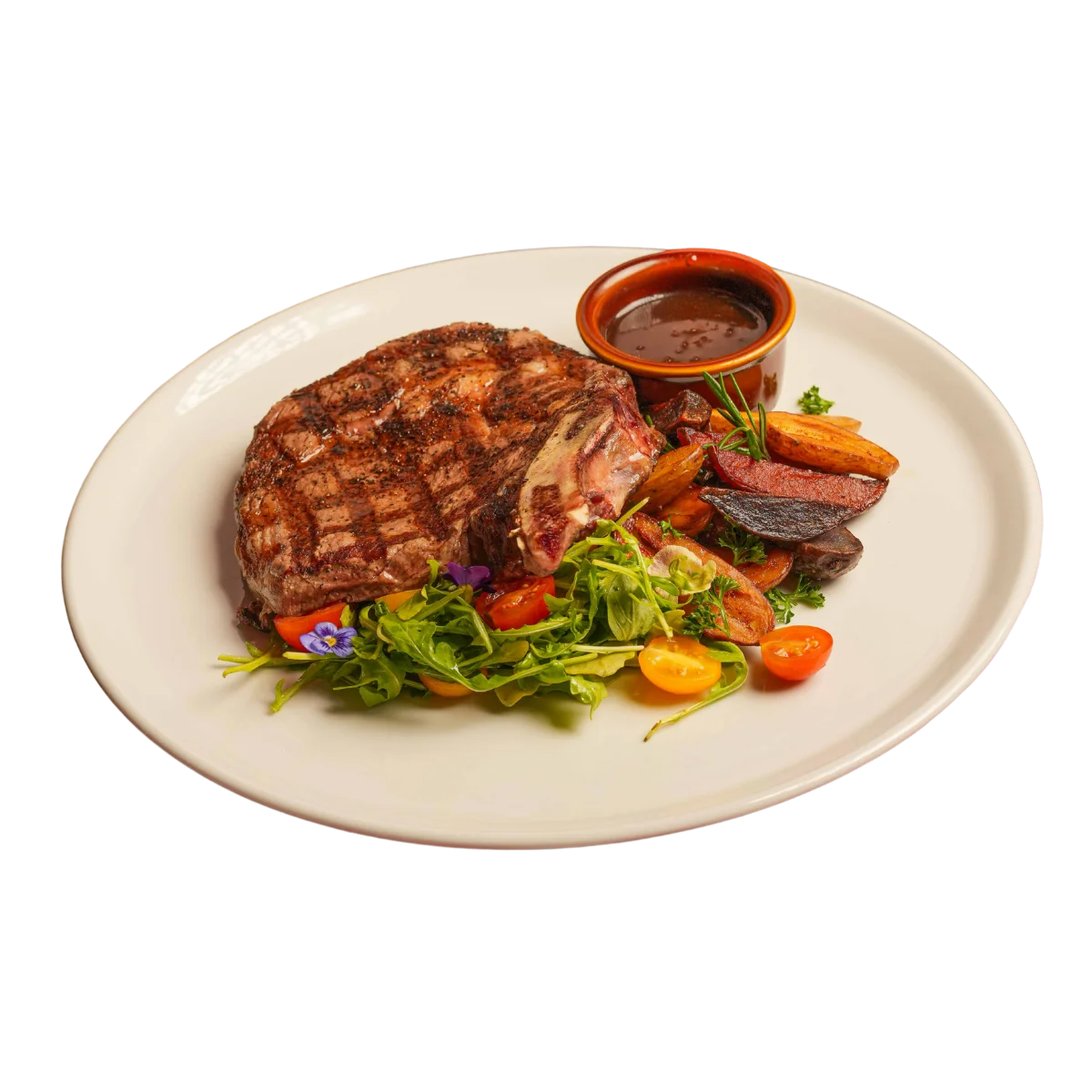 Grilled ribeye steak with fresh salad and sauce