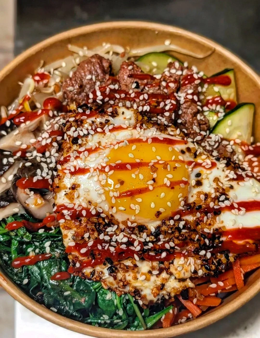 Delicious gourmet burger with fresh toppings on a wooden table