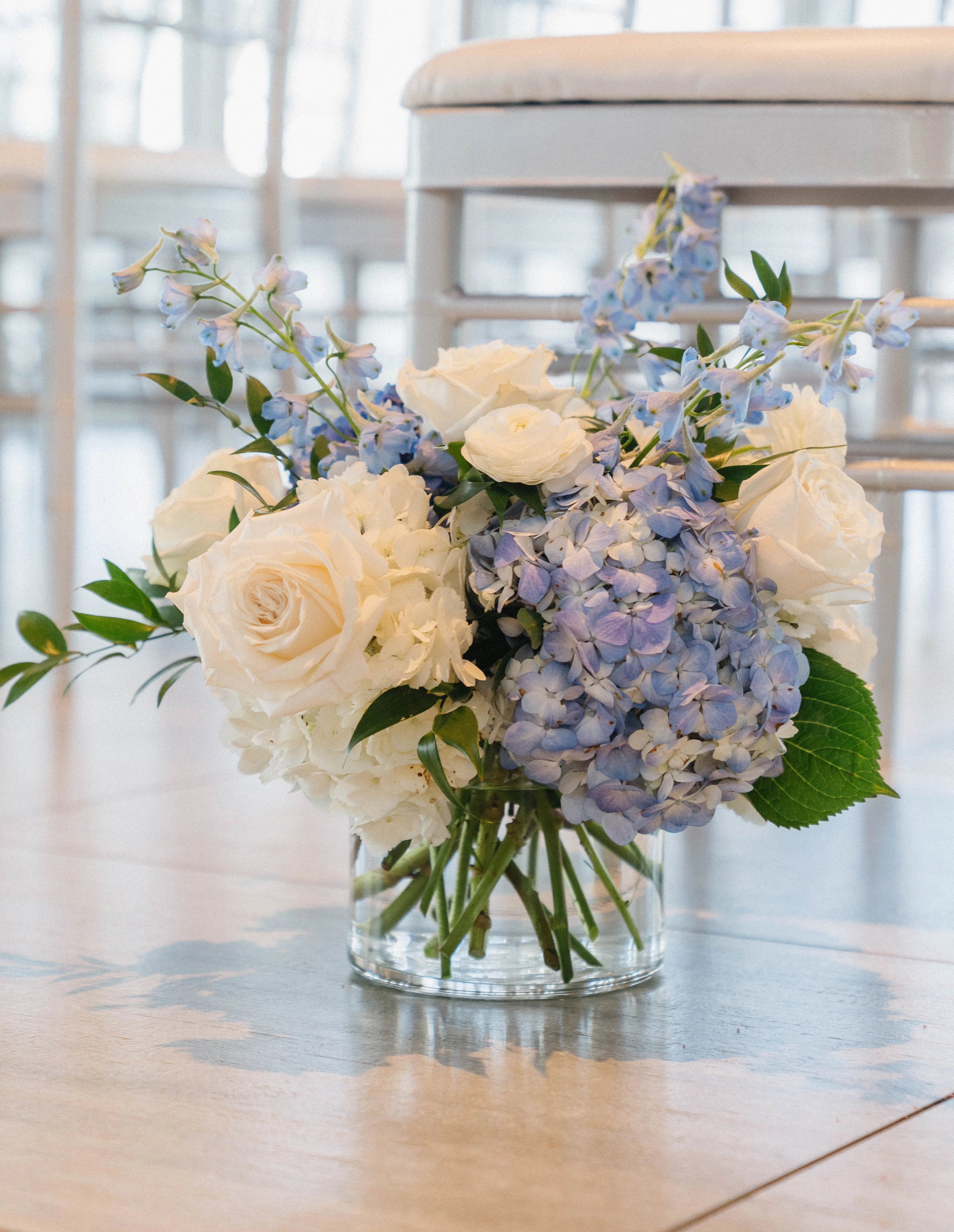 Elegant floral arrangement with blue and white flowers