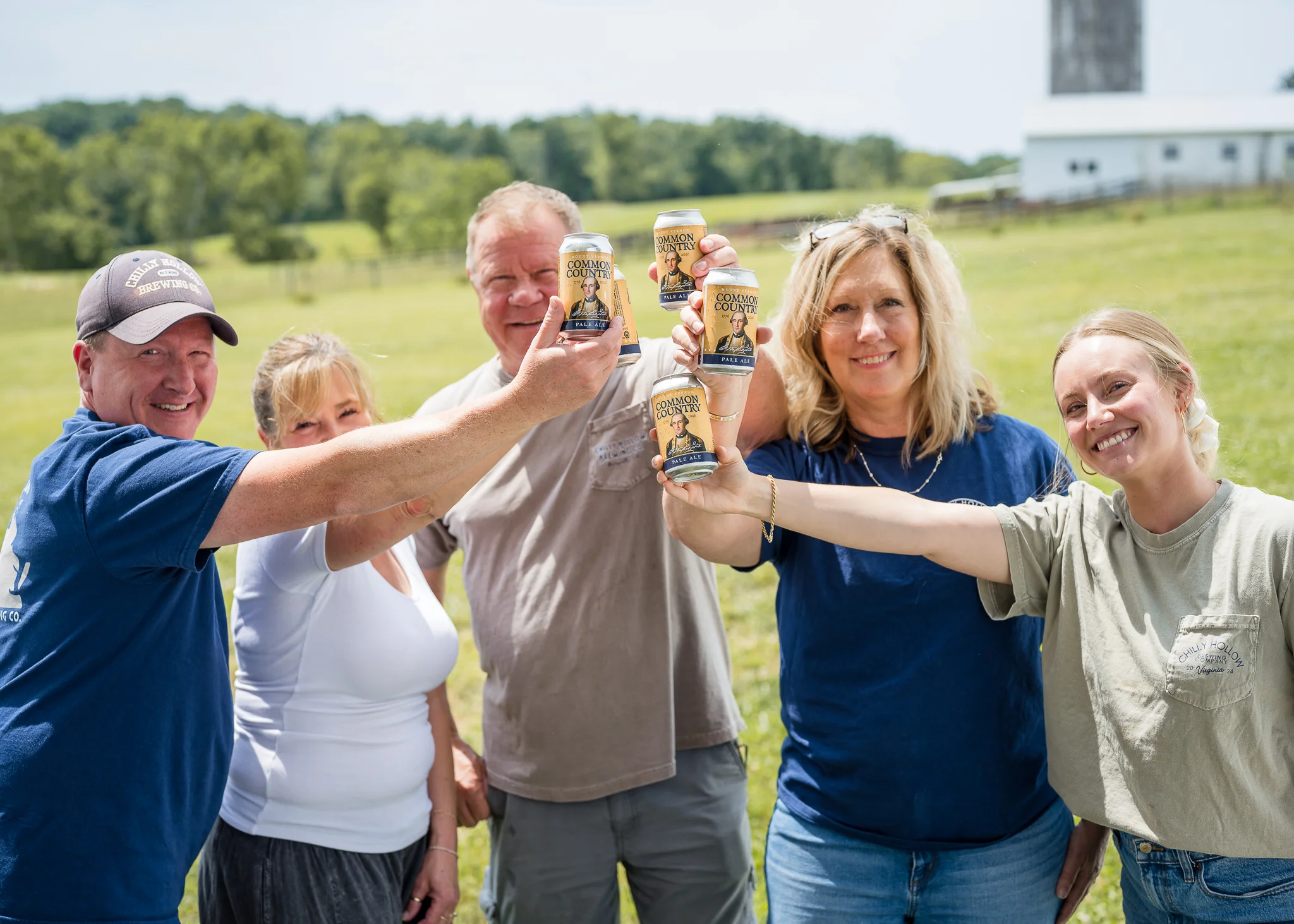 Group celebrating with craft beer outdoors