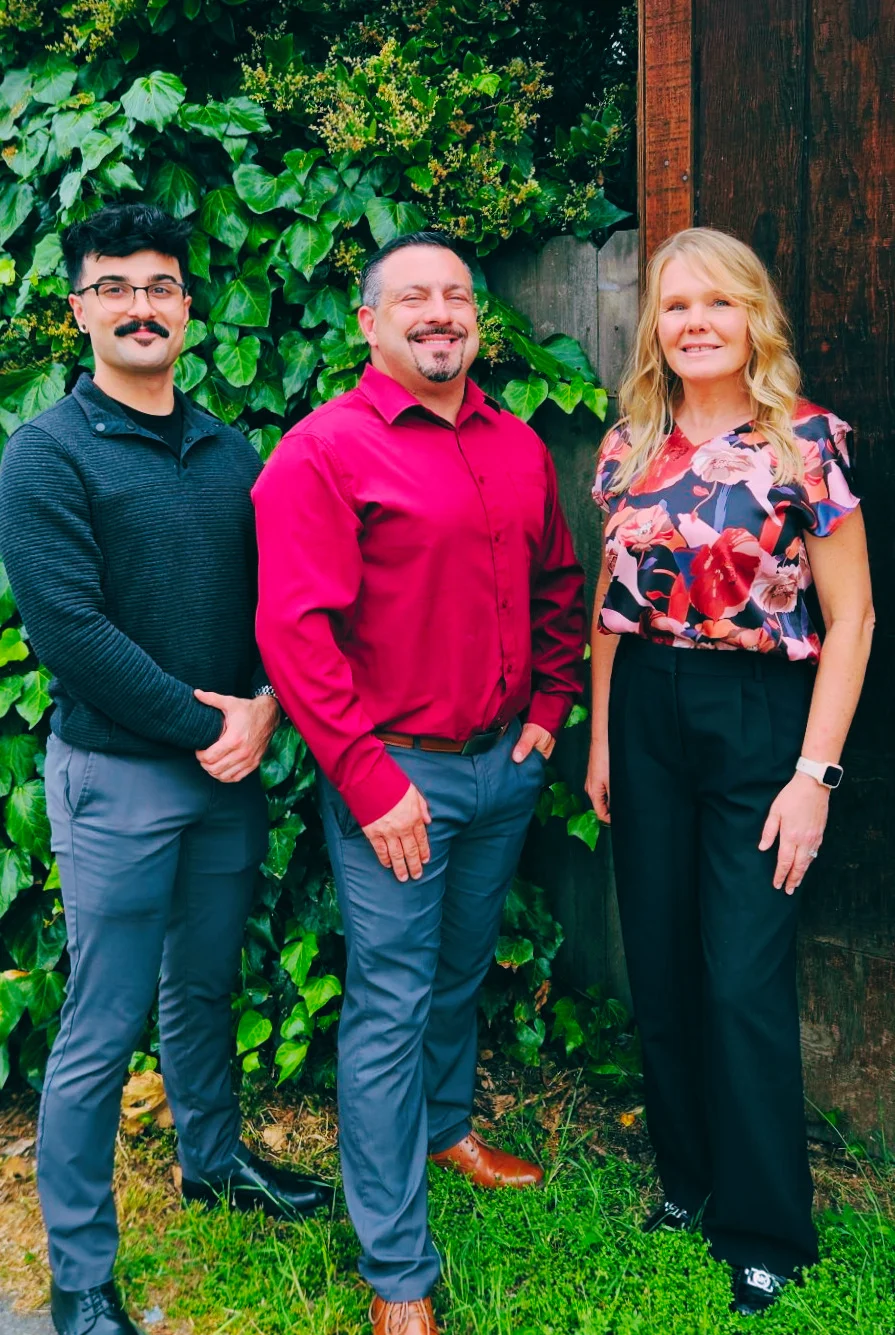 Team of restaurant professionals posing outdoors
