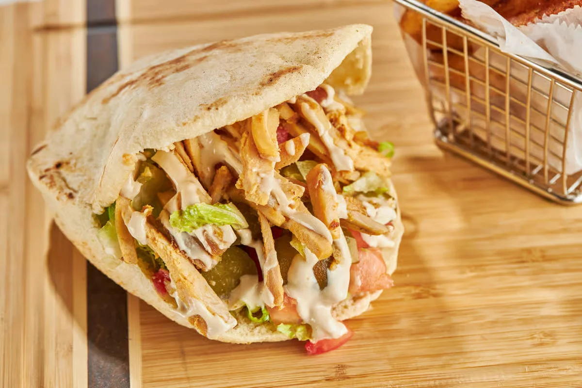 Delicious chicken shawarma wrap in pita bread