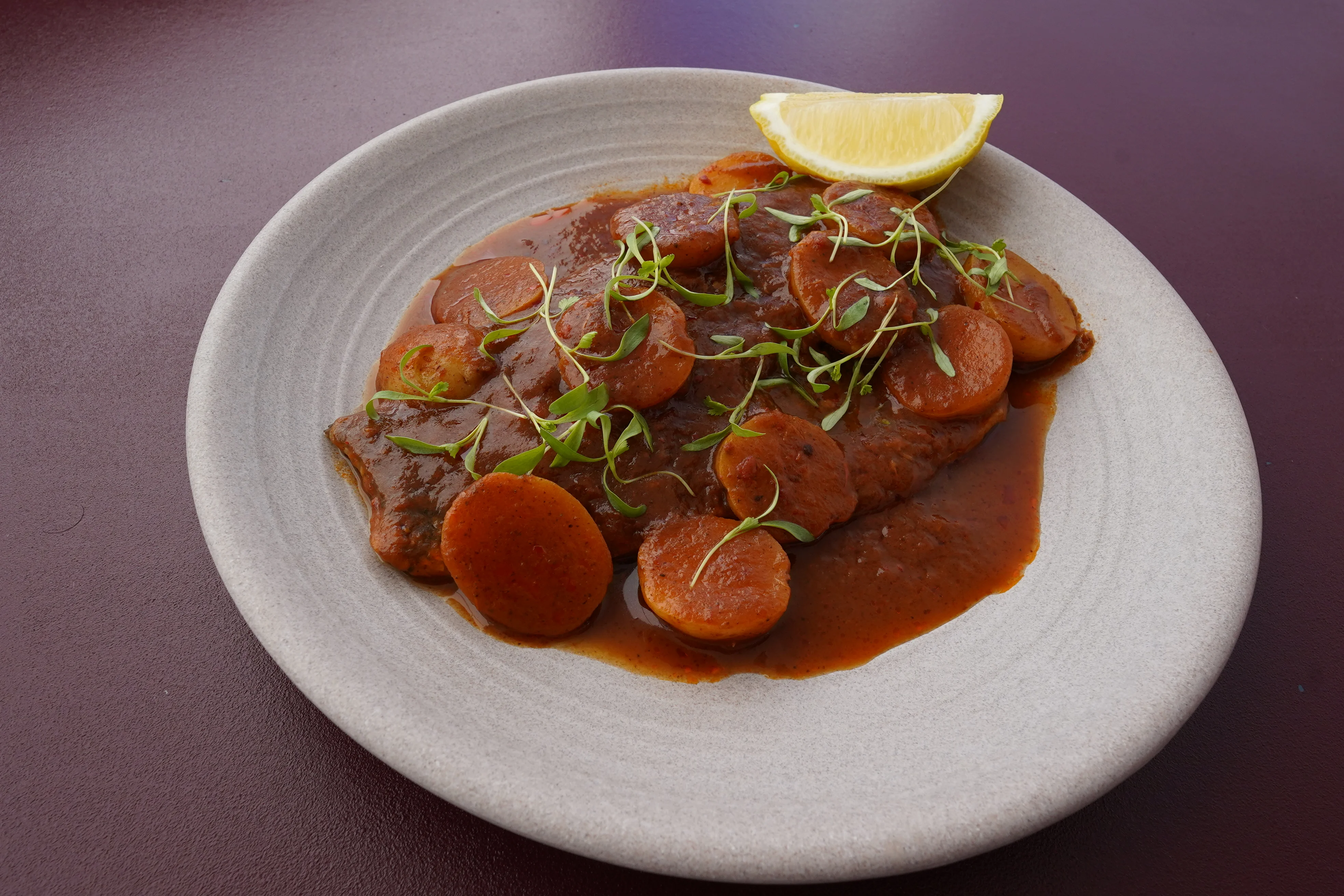 Savory Caribbean stew with tender meat and vegetables
