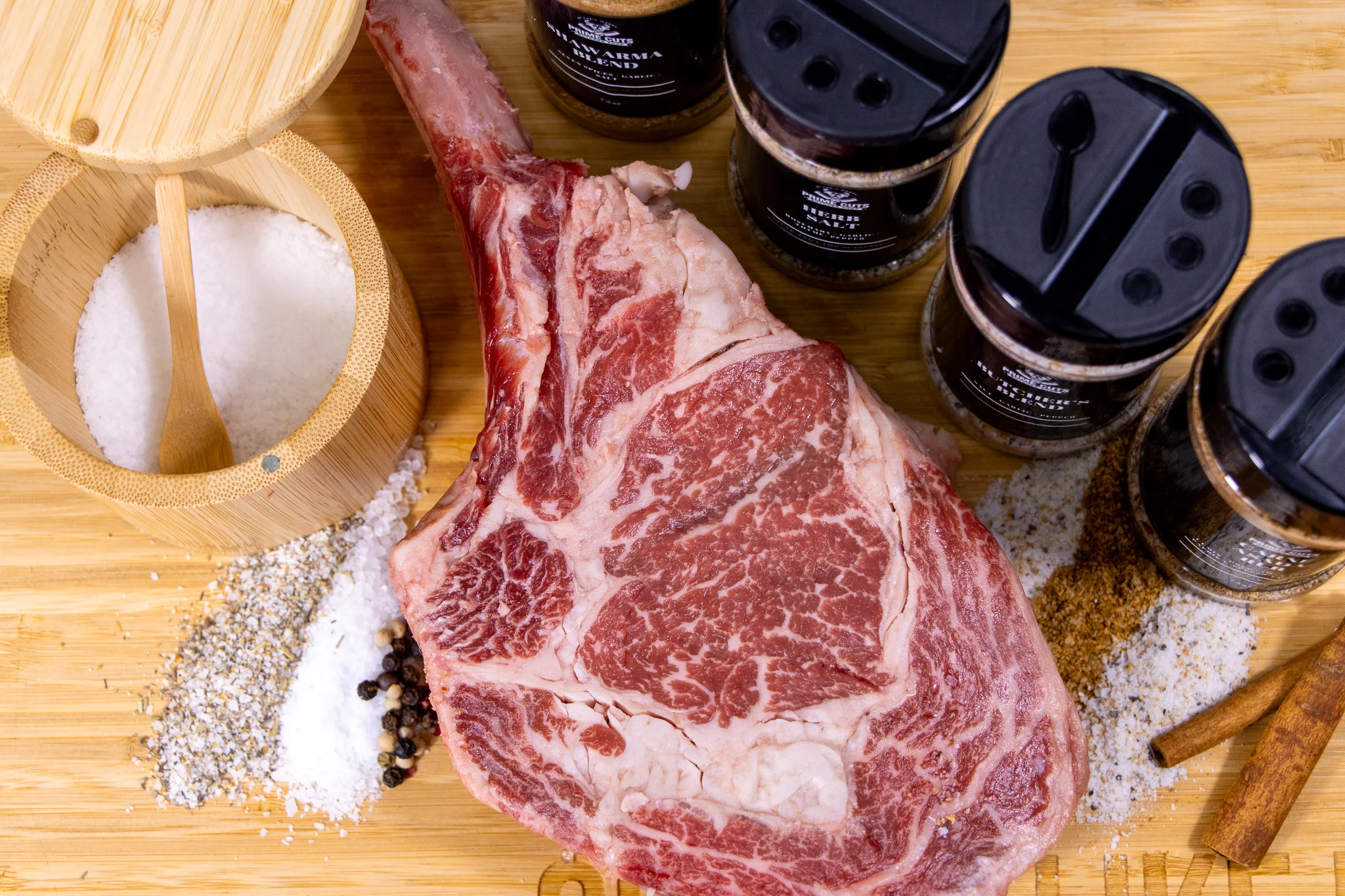 Raw tomahawk steak ready for seasoning
