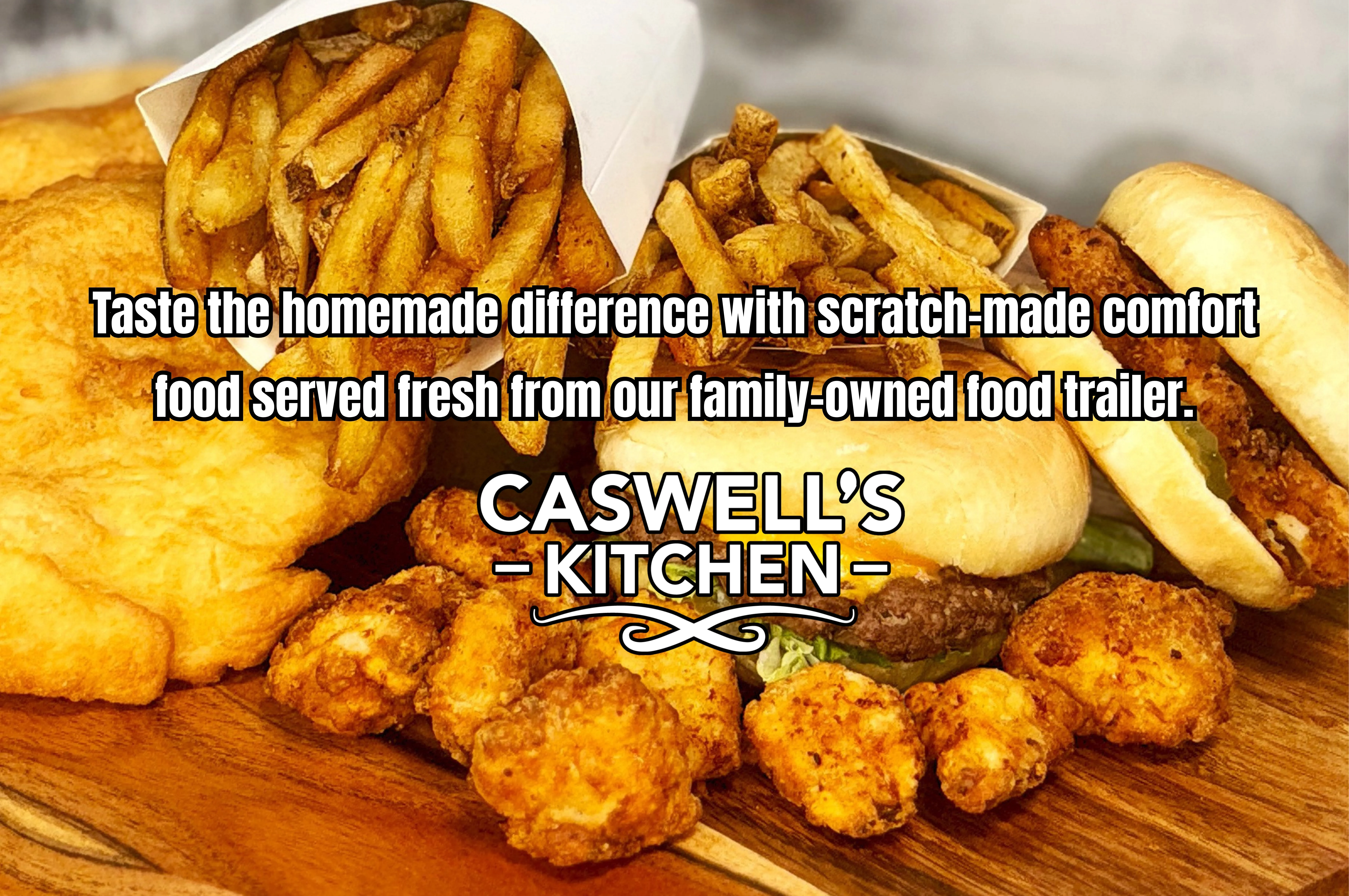 A delicious spread of burgers, fries, and chicken bites on a wooden board.
