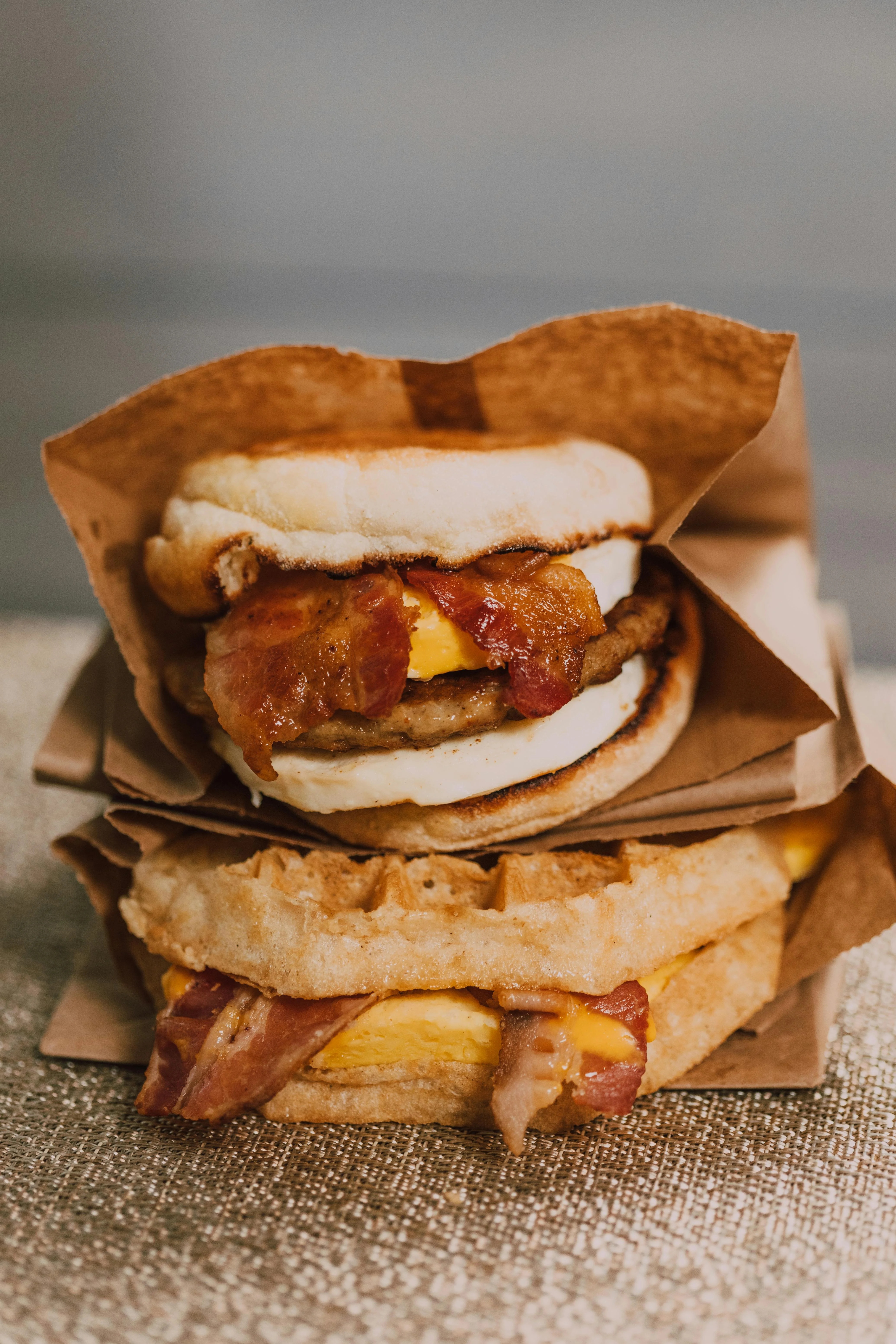 Breakfast sandwich stack with bacon and egg