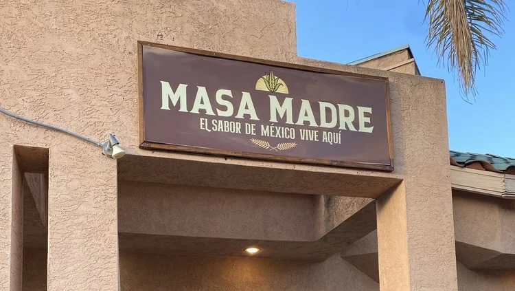 Exterior view of Masa Madre Mexican restaurant with open door
