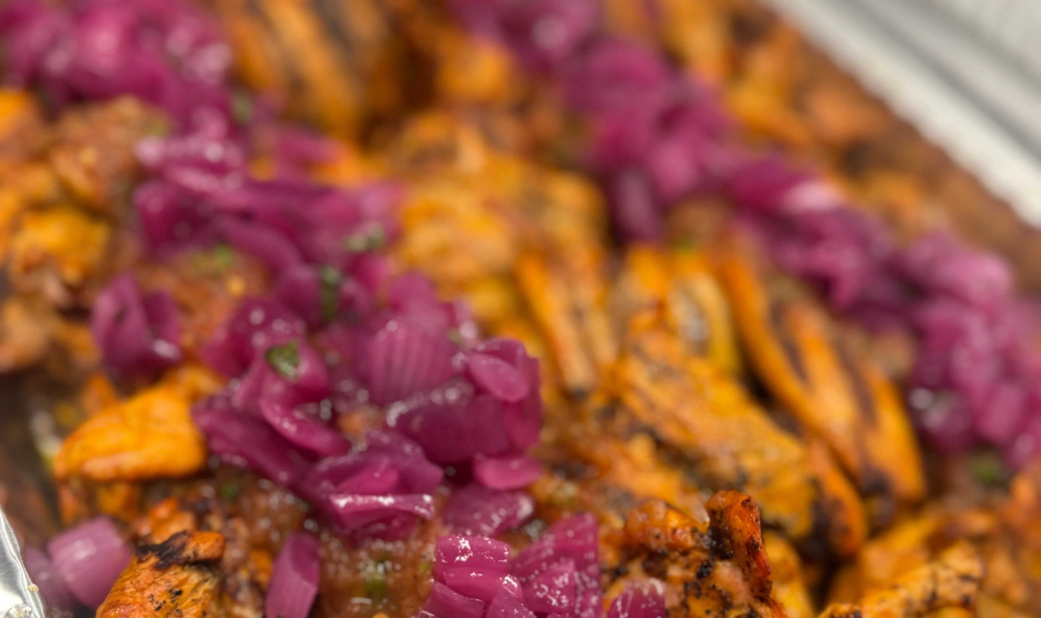 Grilled chicken shawarma with pickled onions