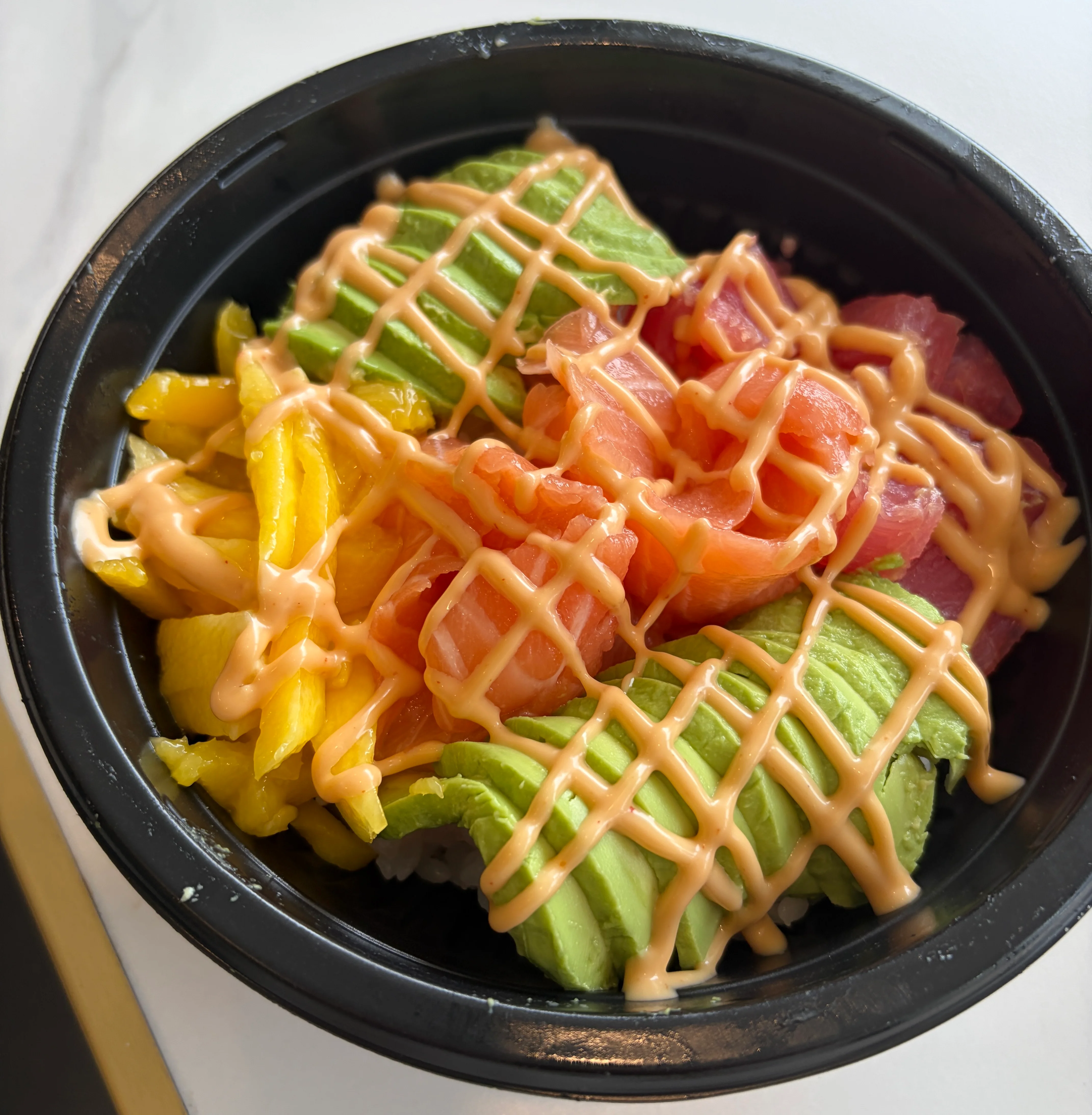 Colorful poke bowl with fresh fish and avocado