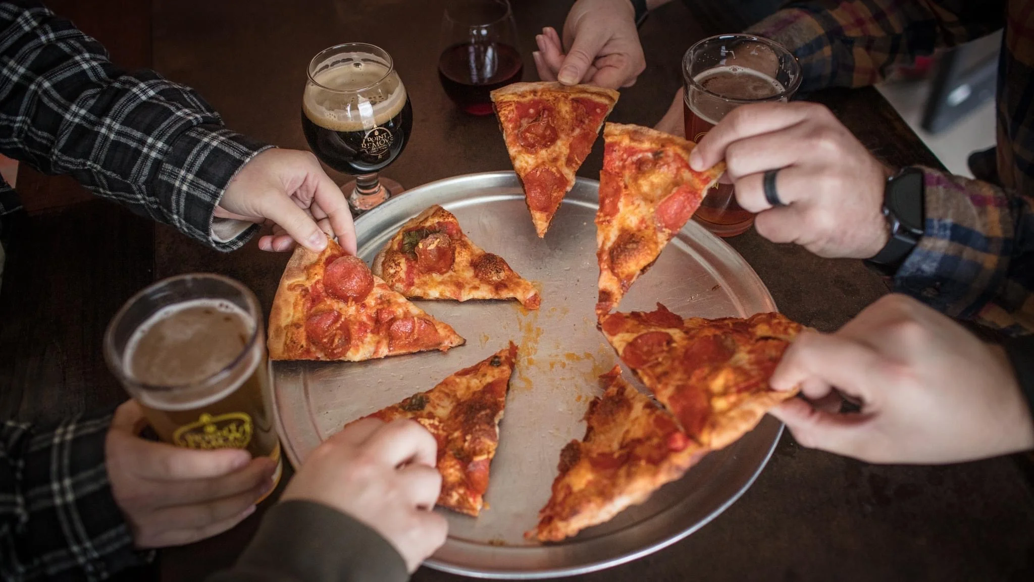 Pepperoni pizza served with craft beers