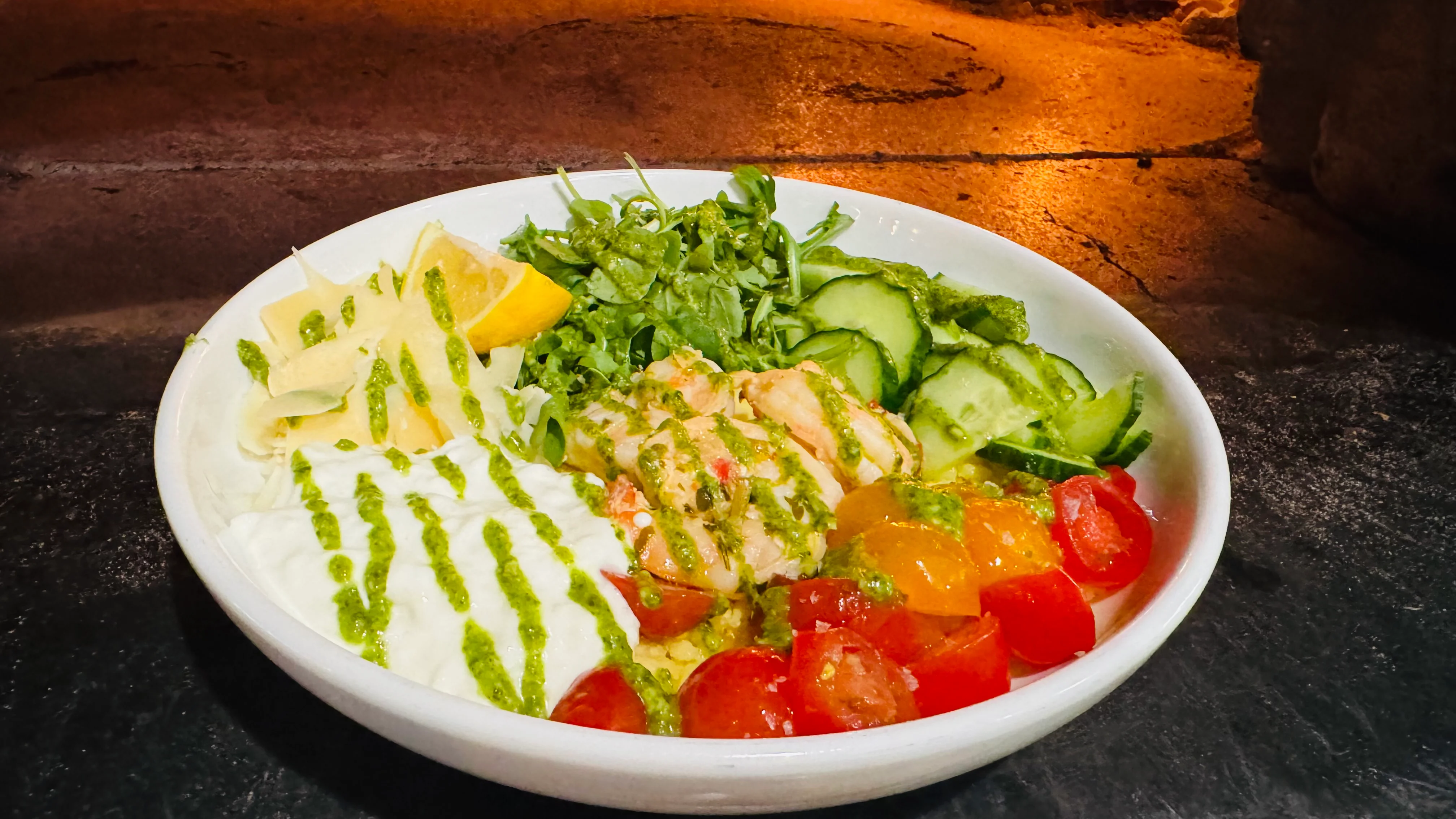 Mediterranean salad bowl with fresh vegetables and herbs