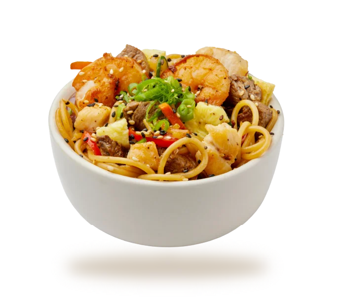 Colorful vegetable fried rice in a bowl with green onions
