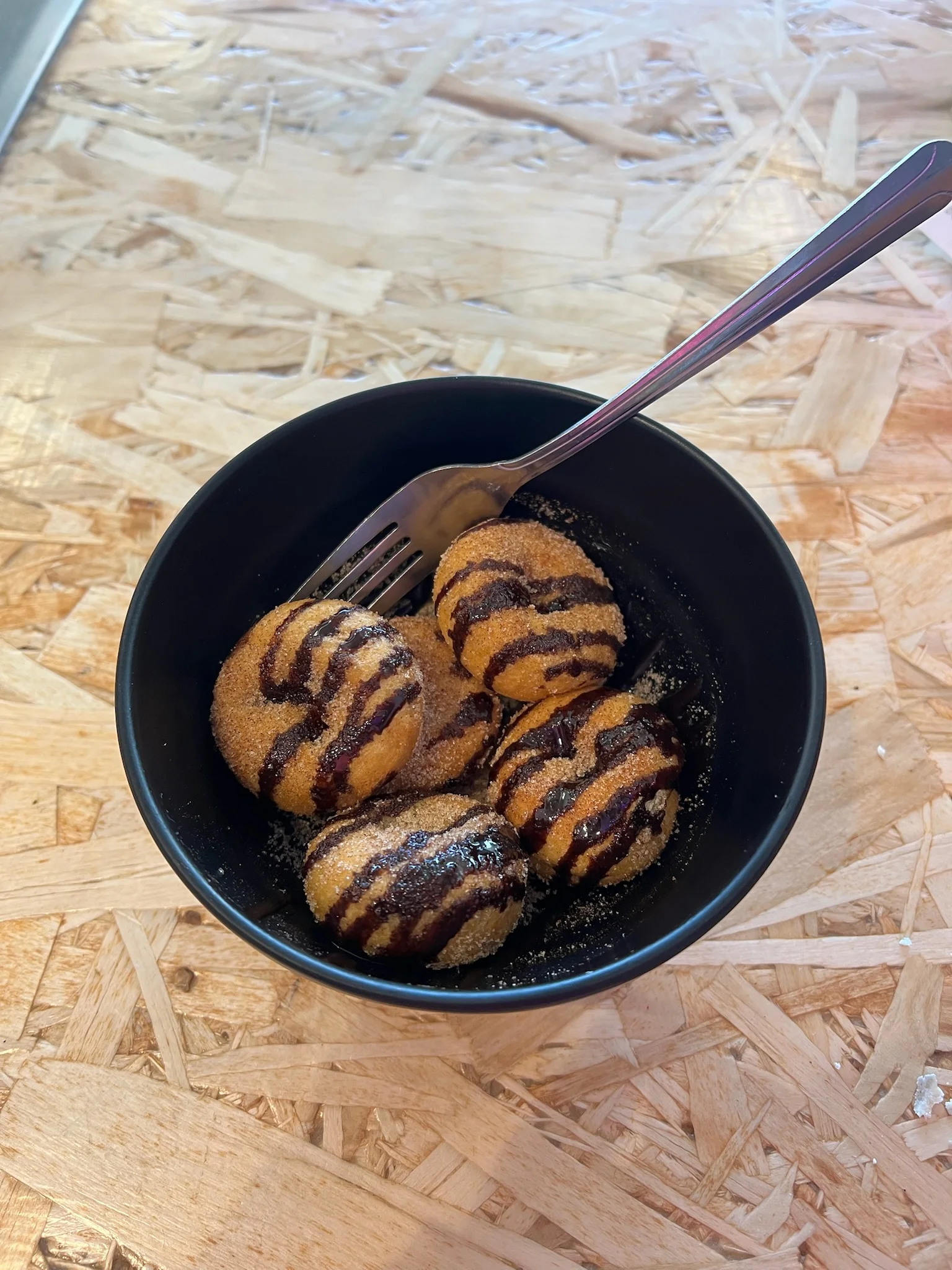 Delicious churros drizzled with chocolate sauce