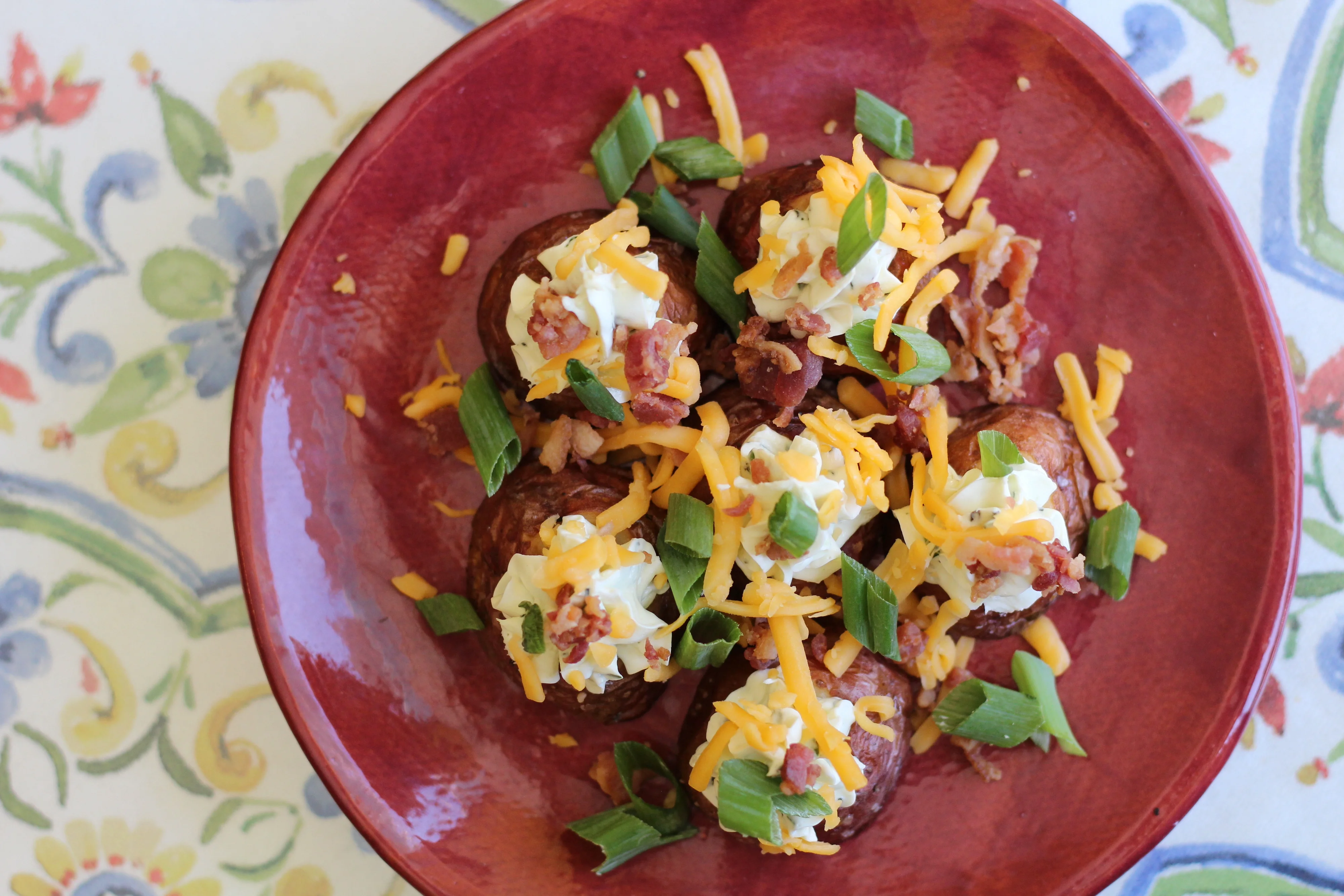 Loaded potato bites with boursin, cheddar, bacon & green onion