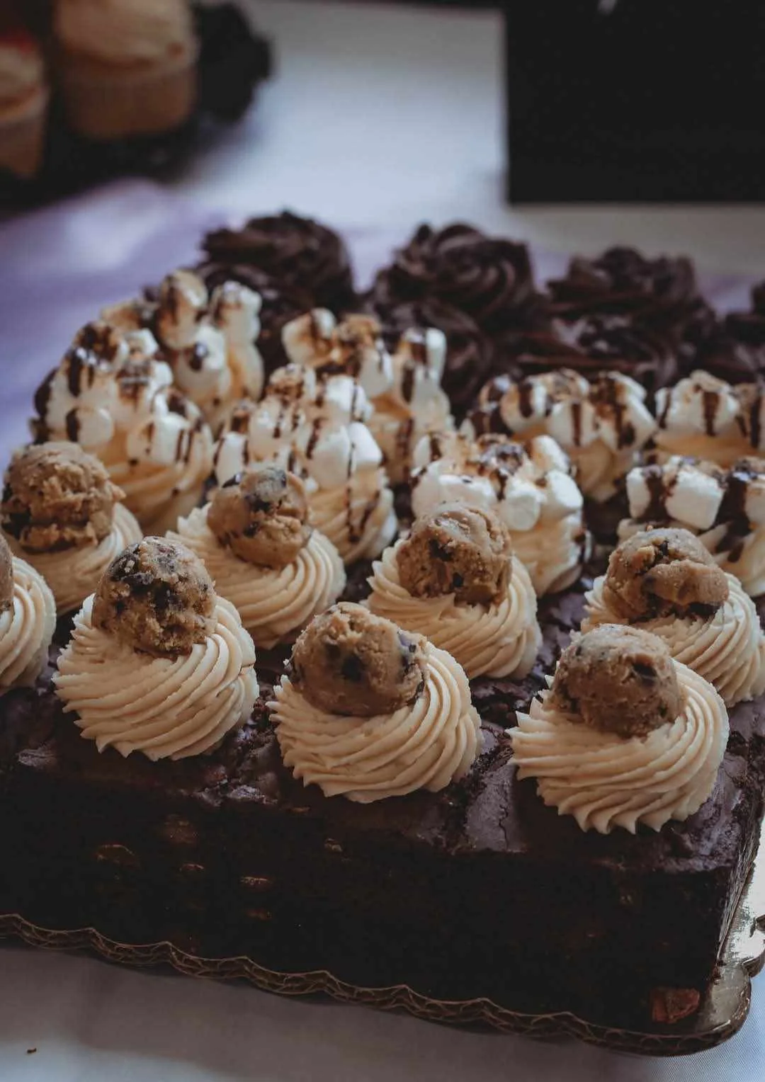 Decadent chocolate brownie cake with cookie dough frosting