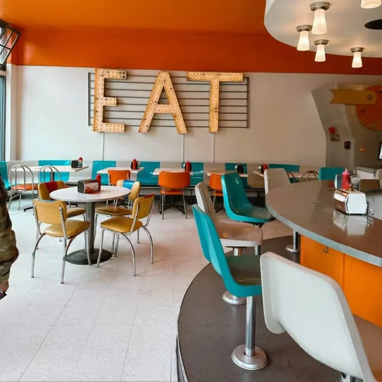 Delicious gourmet burger with fresh toppings on a wooden table.