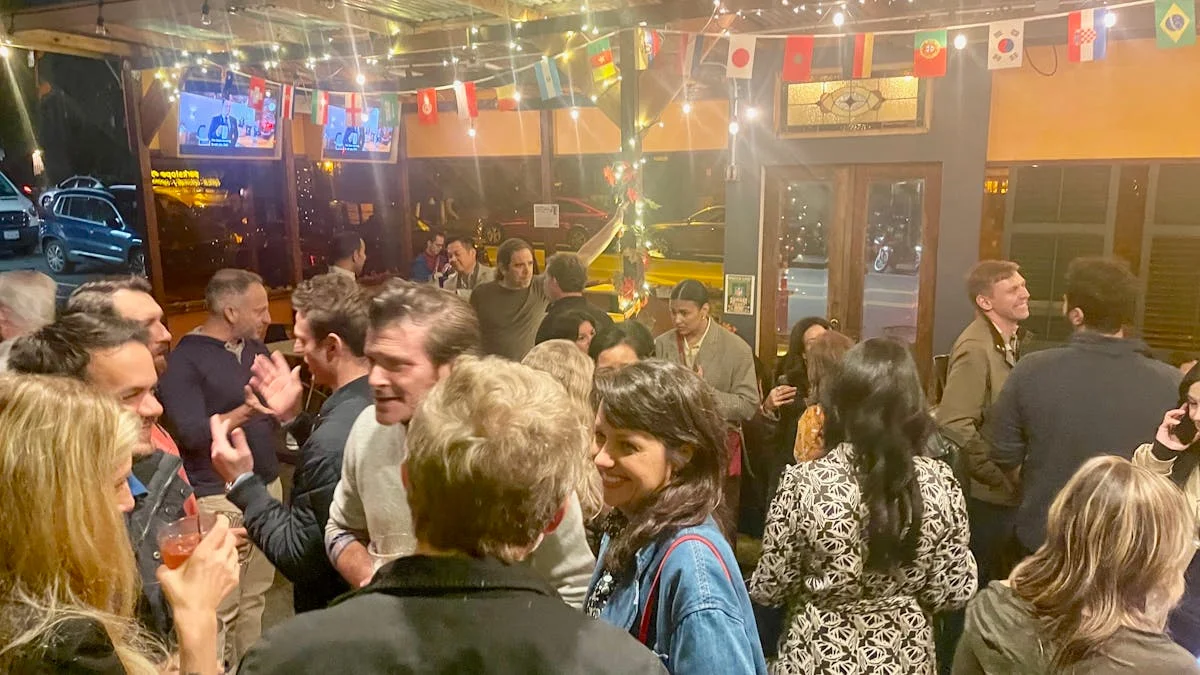 Lively restaurant interior with diverse crowd and festive decorations