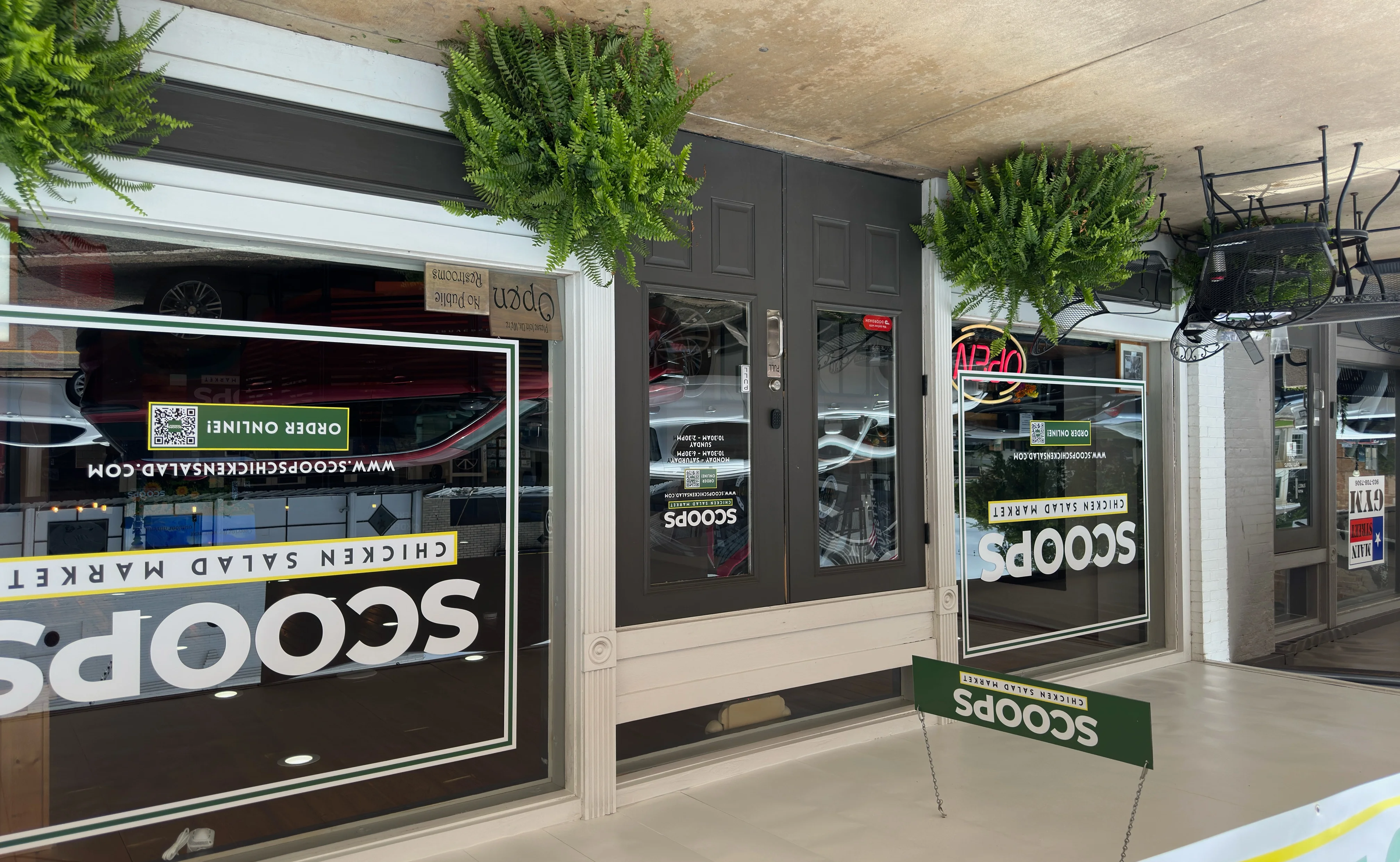 Exterior view of Scoops Chicken Salad Market with open sign
