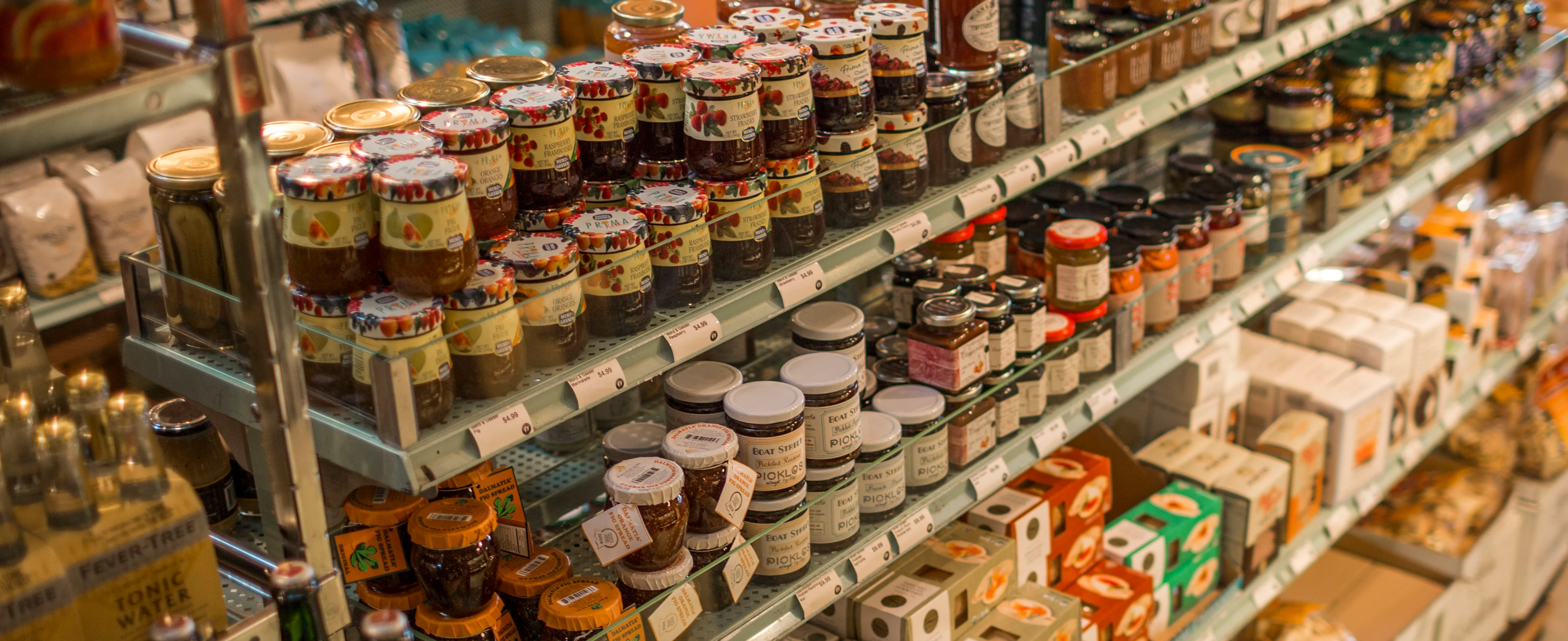 A glimpse of the kinds of imported grocery goods in little jars on the shelf