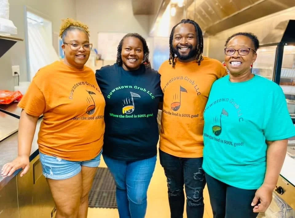 Team members of Downtown Grub LLC in colorful shirts