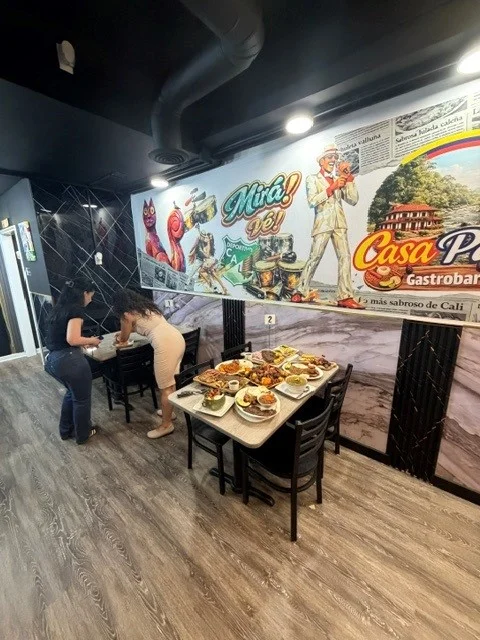 Vibrant restaurant interior with diverse Colombian dishes