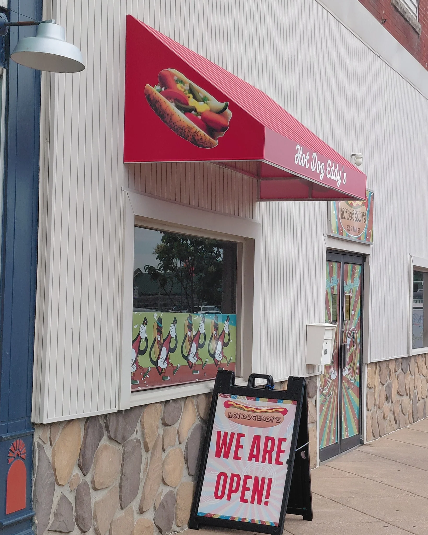 Exterior of Hot Dog Eddy's restaurant with open sign