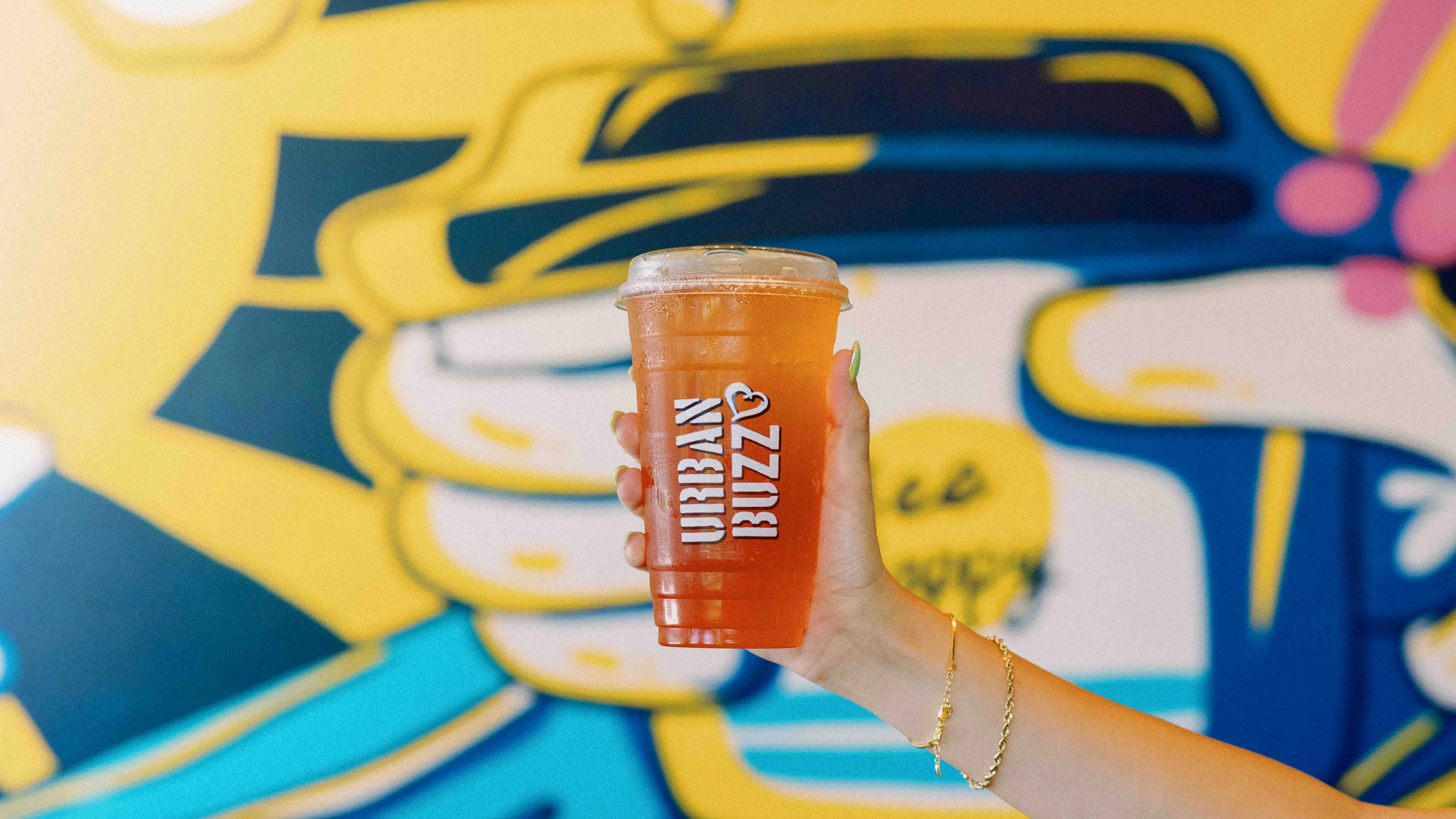 Refreshing iced tea in a clear cup from Urban Buzz Coffee