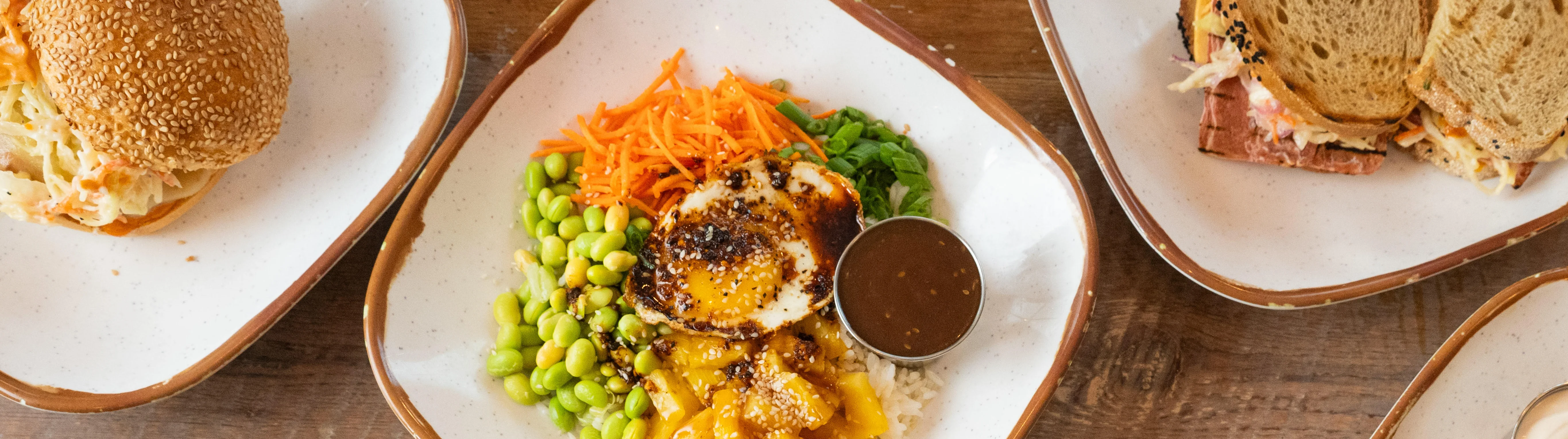 Colorful Mexican rice bowl with guacamole and black beans