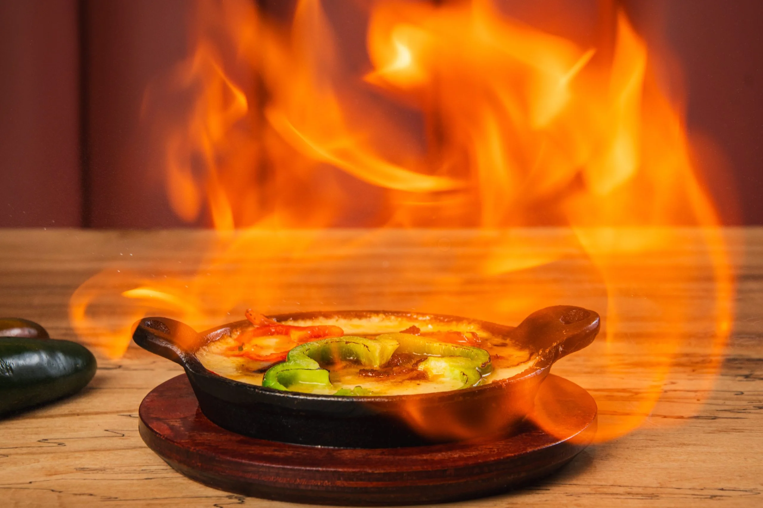 Sizzling fajitas served in a cast iron skillet