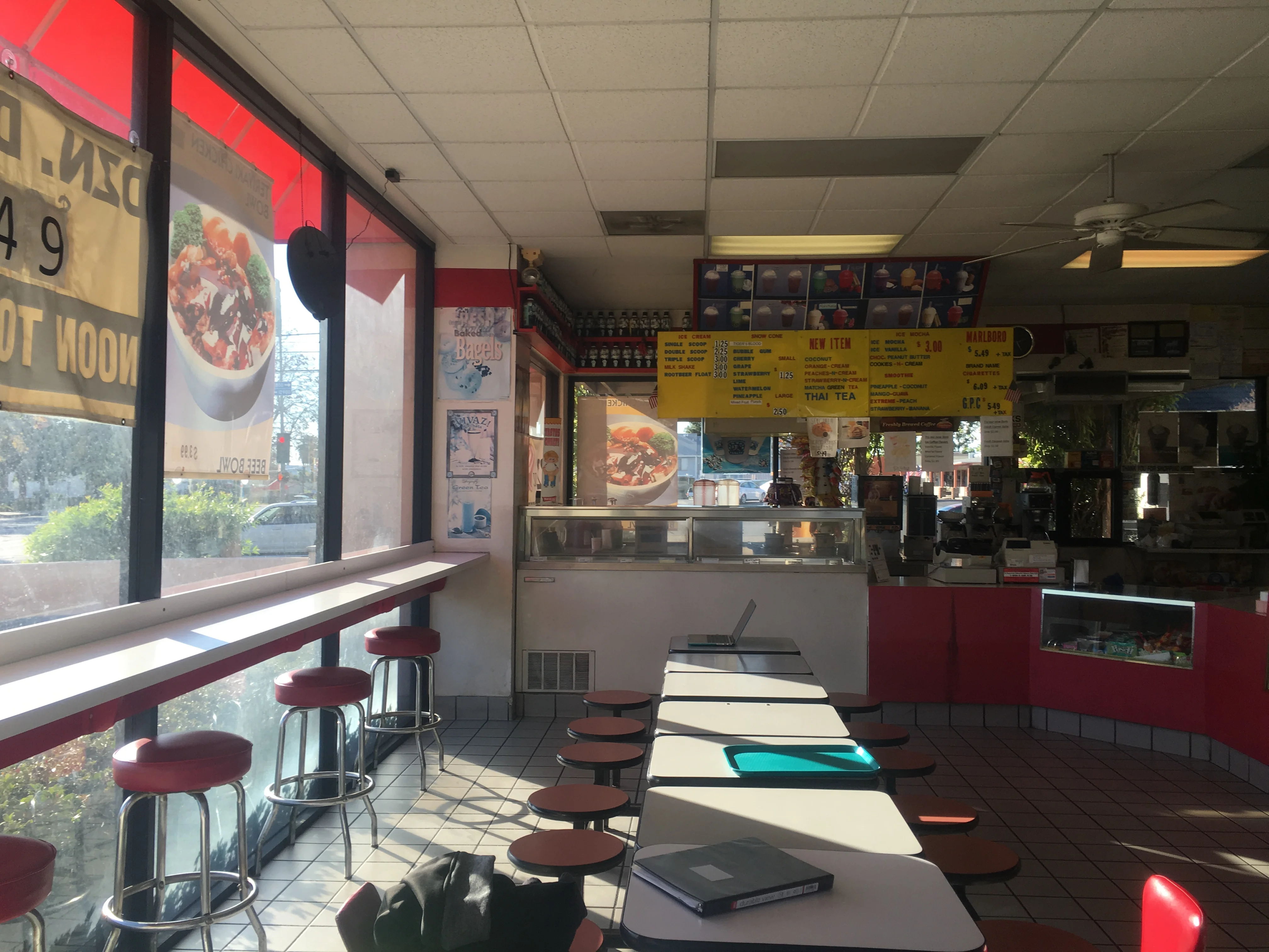  Older in store image of Painted Dough storefront in Chino, California with warm inviting sentence that says "Dough to dream, our journey is just beginning".