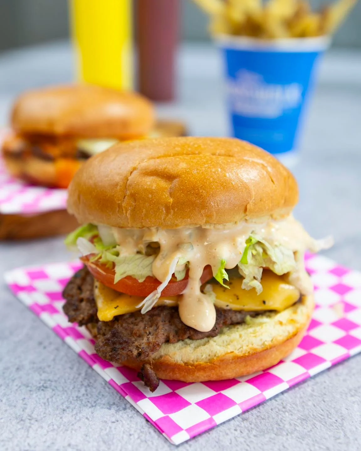 Juicy cheeseburger with special sauce and fresh toppings
