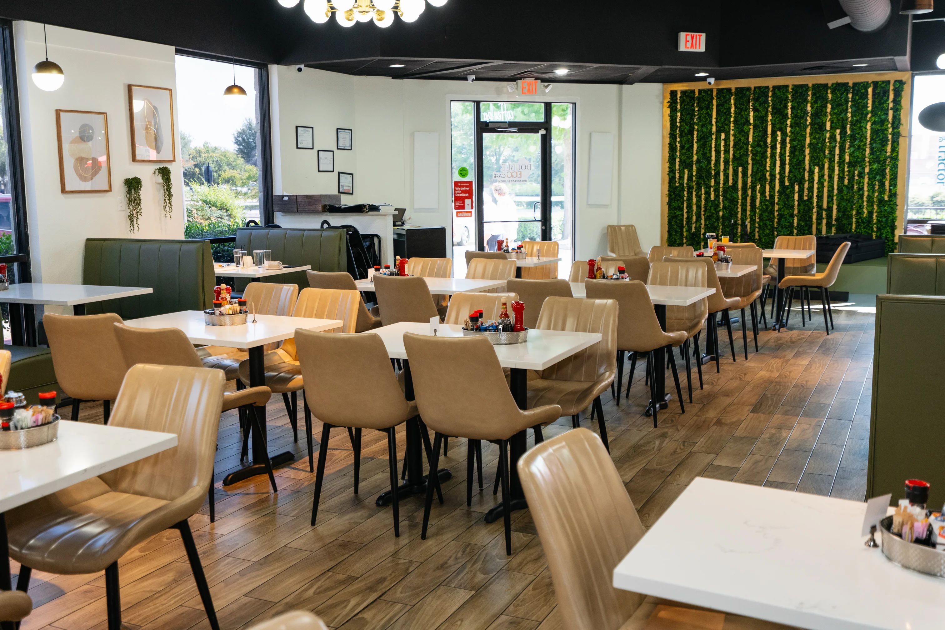 Modern café interior with stylish seating and greenery decor